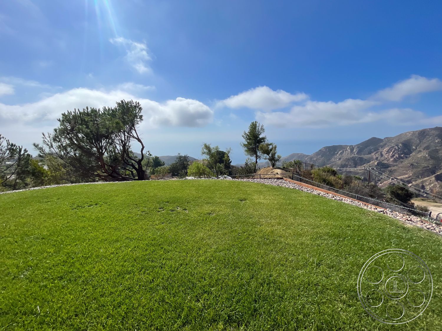 Modern 56 - outdoor space, natural vegetation, exterior landscaping, mountain view, green grass lawn, open sky, rural environment, hilly terrain, landscape setting, rock border landscaping