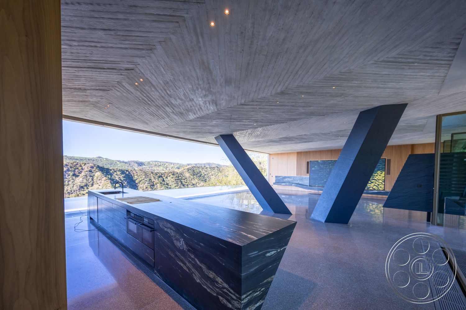 Modern 516 - polished concrete flooring, floor-to-ceiling windows, open concept living space, textured wall finishes, exposed concrete ceiling, modern minimalist design, interior chef's kitchen, wood panel accent wall, contemporary art display, built-in kitchen cabinetry, angular architectural forms, interior outdoor flow, black marble kitchen island, panoramic mountain view, steel structural supports