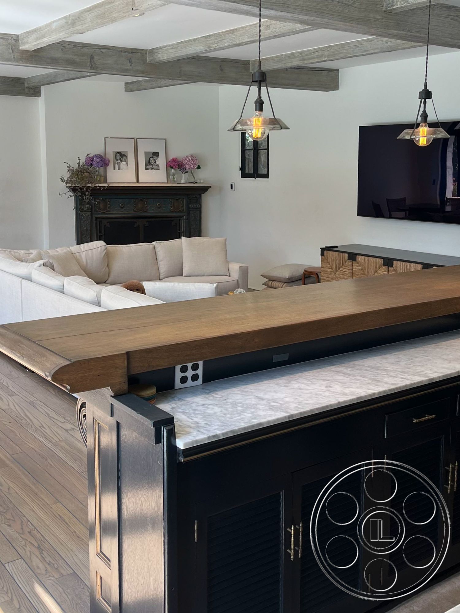 Medit 166 - neutral color palette interior, exposed wood ceiling beams interior, white painted walls interior, hardwood living room floors interior, open concept living area interior, dark wood cabinetry interior, marble kitchen countertop interior, modern light fixtures interior, fireplace with ornate detailing interior, elegant seating area interior, luxury home styling interior, flat-screen TV wall mount interior, decorative floral accents interior, etched glass windows interior, stylish bar counter interior, contemporary furniture arrangement interior