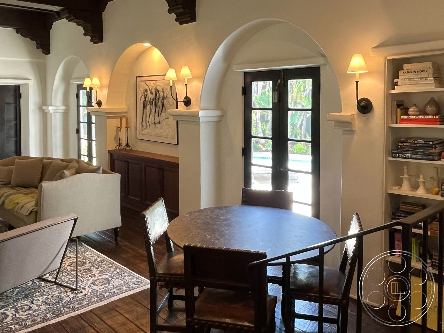 Medit 166 - neutral color palette interior, dark wood paneling interior, exposed wood ceiling beams interior, white painted walls interior, hardwood living room floors interior, floor-to-ceiling windows interior, contemporary coffee table interior, open floor plan interior, textured plaster walls interior, cozy seating area interior, natural light flooding interior, framed artwork on walls interior, arched doorways interior, built-in kitchen cabinets interior, vintage-style light fixtures interior, wood and metal dining chairs interior, area rug with Persian design interior, decorative shelving unit interior, garden view through windows interior, casual dining nook interior, layered textiles for comfort interior