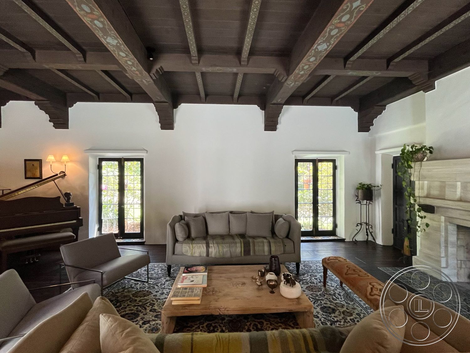 Medit 166 - interior hardwood flooring, interior muted color palette, interior minimalist coffee table, interior white painted walls, interior grand piano, interior natural light exposure, interior patterned area rug, interior decorative potted plants, interior cozy living room, interior wooden ceiling beams, interior modern accent chairs, interior stone fireplace surround, interior contemporary sofa with cushions, interior glass door windows, interior wrought iron light fixtures, interior rustic wood shelving, interior architectural details, interior open space design, interior artistic decor elements