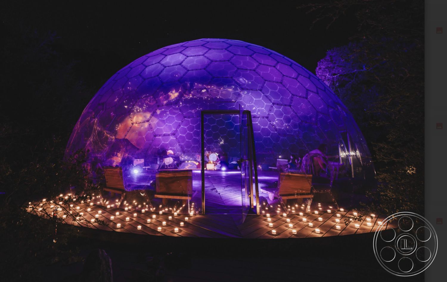 Topanga Retreat - cozy atmosphere, outdoor seating area, surrounding greenery, nighttime setting, modern architectural style, nature-inspired decor, ambient lighting fixtures, wooden deck flooring, interior lounge space, eco-friendly construction, geodesic dome structure, transparent polymer exterior, hexagonal panel design, glamping accommodation, exterior with integrated lighting