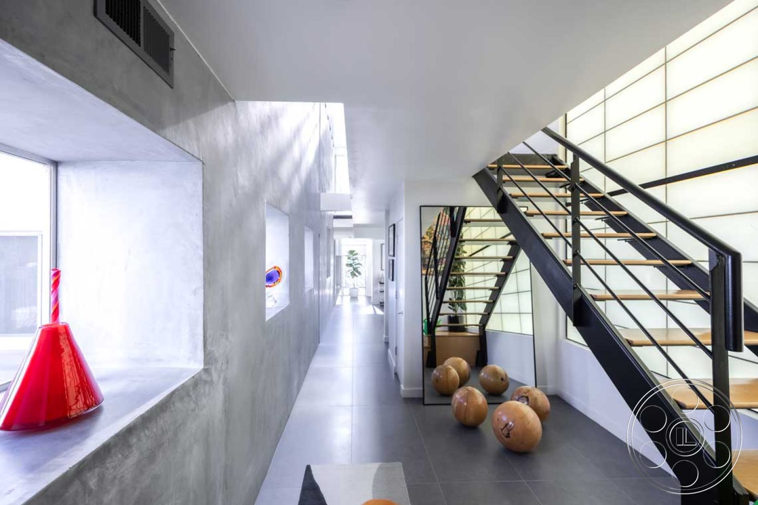 Modern 56 - high ceilings, open layout, minimalist design elements, textured wall treatments, floating staircase, modern art decor, contemporary architectural style, exposed wood ceiling beams, interior polished concrete flooring, interior glass partition walls, steel stair railings, interior concrete walls, geometric shapes and forms, natural light influx, rectangular entry hallway