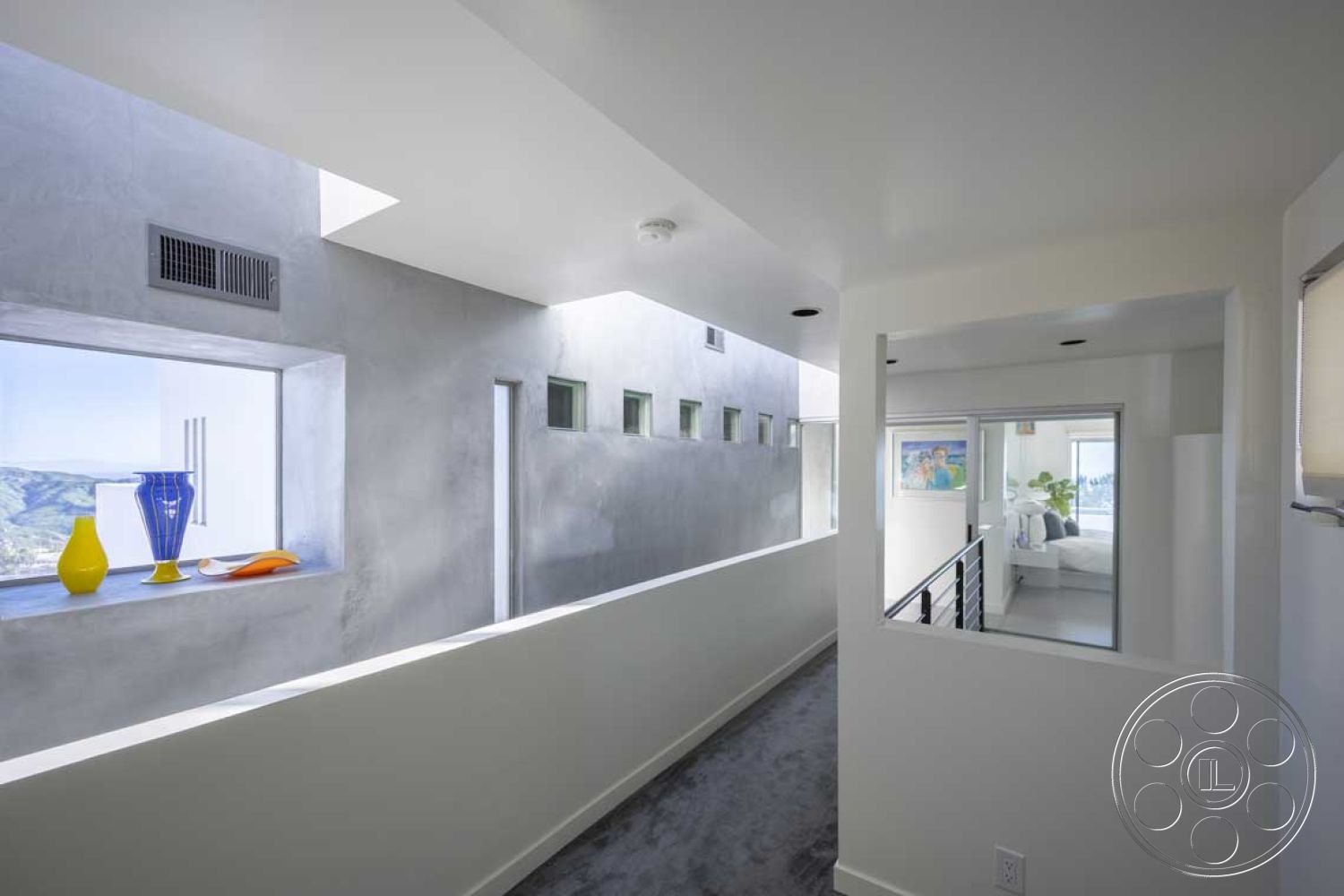 Modern 56 - modern architectural style, minimalist interior design, white painted walls interior, exposed concrete walls interior, geometric shapes in architecture, linear hallway layout, glass window treatments interior, contemporary decor accents, skylight openings interior, concrete floors interior, steel railings interior, bright natural lighting interior, open corridor space interior, functional living space design