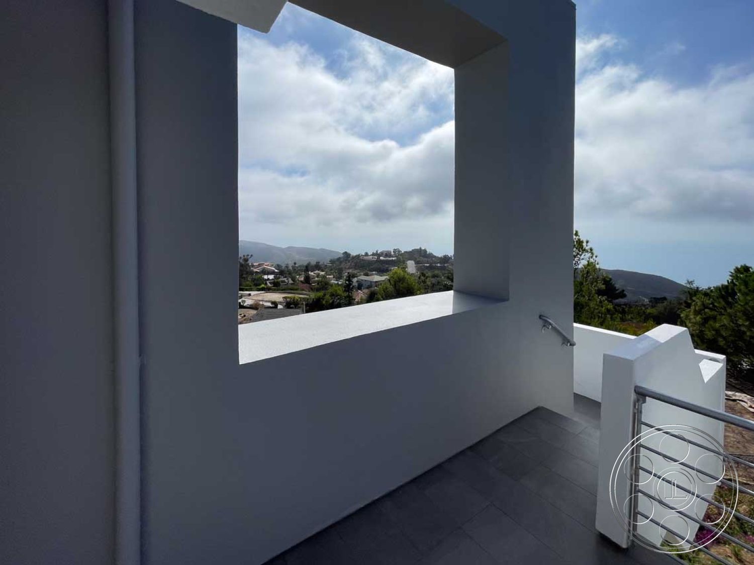 Modern 56 - neutral color palette, flat roof, contemporary outdoor space, stainless steel railing, exterior concrete patio floor, exterior concrete walls, modern minimalist architecture, rectangular window opening, landscape view from balcony, open balcony design, mountain setting