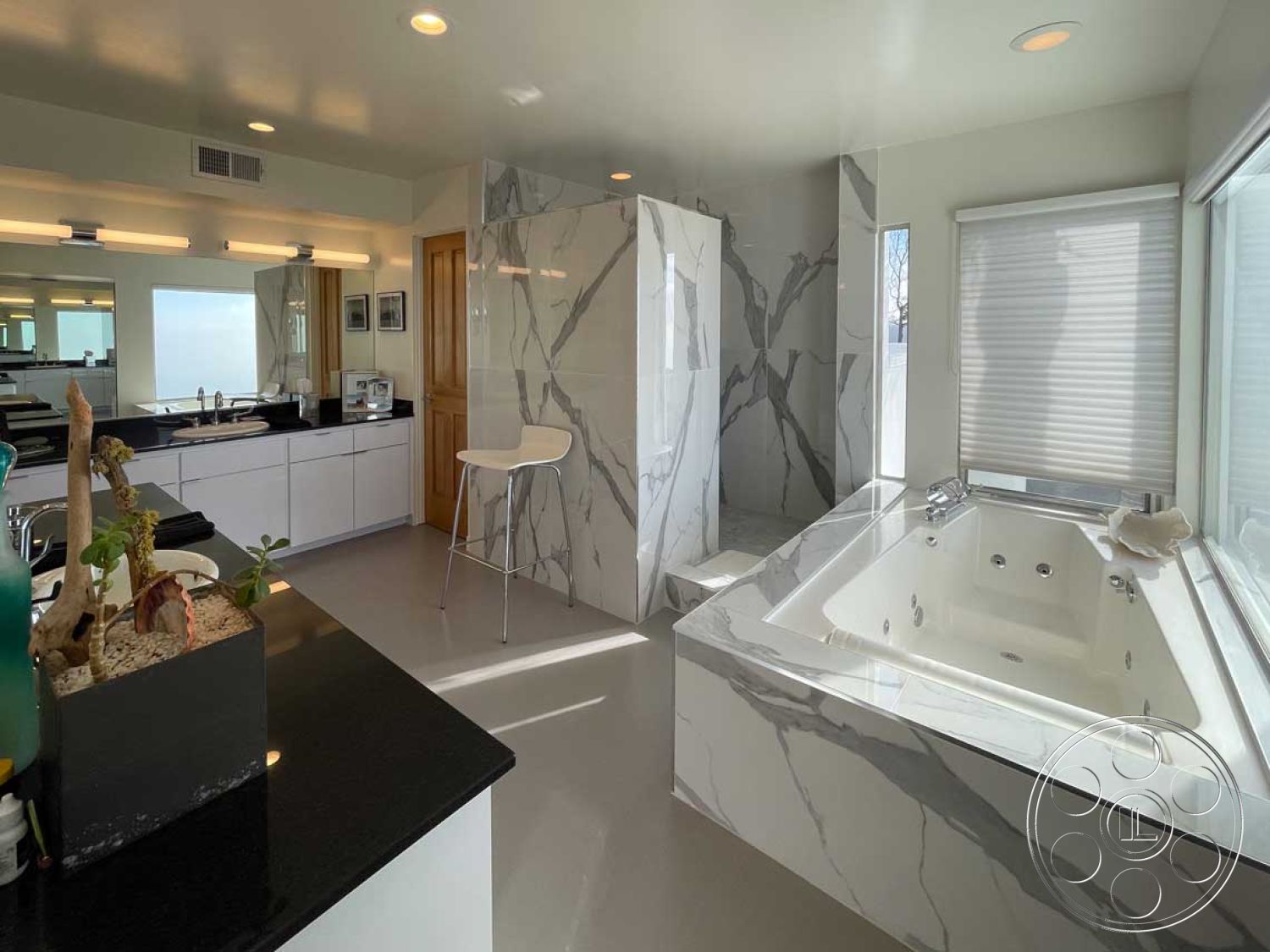 Modern 56 - interior neutral color palette, interior white painted walls, interior minimalist design, interior large mirrors, interior recessed ceiling lights, interior marble bathroom walls, interior marble shower enclosure, interior porcelain tile flooring, interior quartz countertop, interior solid wood cabinet, interior freestanding jetted bathtub, interior contemporary bathroom lighting, interior frosted glass window, interior modern vanity, interior open bathroom layout