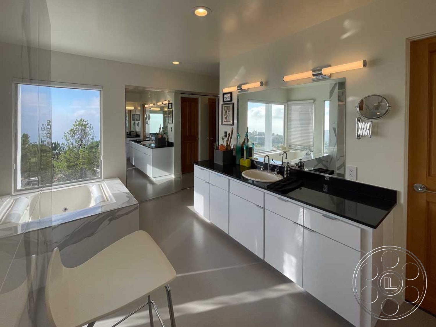 Modern 56 - neutral color palette, minimalist aesthetic, open layout, freestanding bathtub, glass shower enclosure, modern light fixtures, black granite countertop, vinyl flooring, views of trees, interior bathroom design, chrome faucet fixtures, functional storage solutions, white painted walls, natural light emphasis, contemporary cabinetry, rectangular window view, sleek mirror wall, single sink vanity