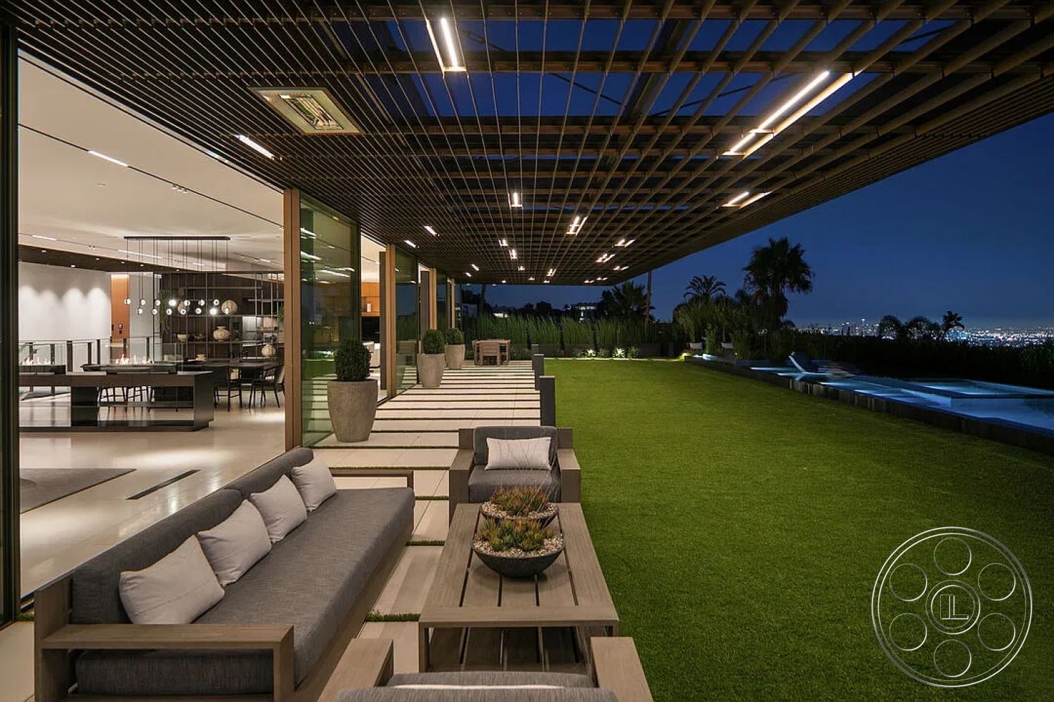 Modern 517 - interior modern pendant lighting, interior stainless steel kitchen appliances, interior contemporary decor, interior open concept design, exterior concrete pool area, interior living area with large glass doors, exterior terrace with artificial grass, exterior wood pergola with recessed lighting, interior dining space with modern fixtures, exterior family seating area with sectional sofa, interior hardwood flooring in living room, exterior landscape lighting elements, exterior raised garden area, exterior long rectangular seating arrangement, exterior view of city skyline, exterior stone accents surrounding pool, exterior minimalist design features, interior spacious layout with clean lines, exterior nighttime ambiance with soft lighting