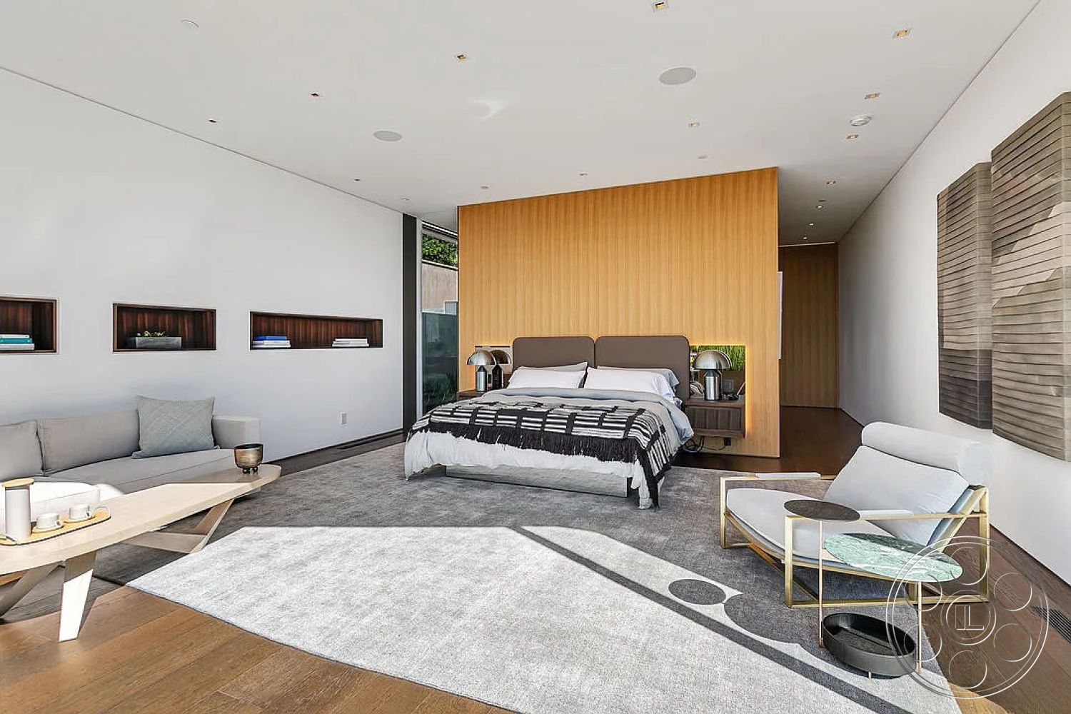 Modern 517 - neutral color palette, contemporary furniture, plush bedding, glass coffee table, cozy seating area, floor-to-ceiling windows, decorative wall art, geometric area rug, soft natural lighting, zen-inspired decor, modern minimalist design, hardwood bedroom floors, open floor plan interior, smooth white painted walls, custom built-in shelving, textured wood accent wall, spacious master bedroom, sleek bedside tables