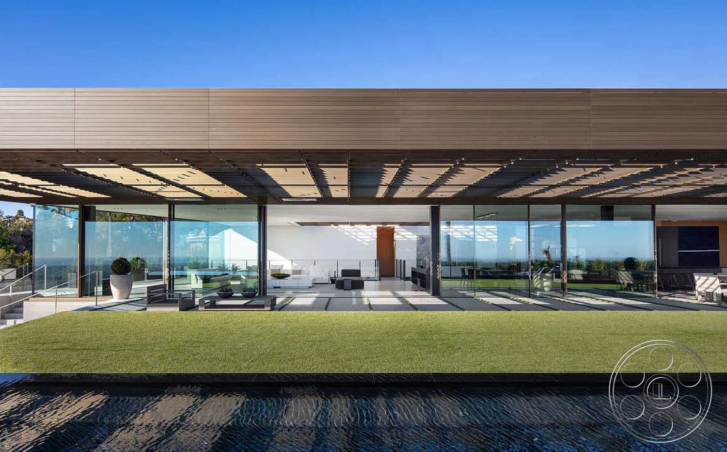 Modern 517 - interior neutral color palette, interior recessed lighting, interior open floor plan, interior contemporary decor, interior minimalist furniture, exterior modern architectural design, interior seamless indoor-outdoor flow, interior glass wall, interior sleek cabinetry, interior white plaster walls, exterior wooden slat pergola, exterior landscaped lawn, interior stone water feature, exterior hardscape patio, exterior rectilinear pool design, exterior panoramic glass windows, exterior lush green surroundings, exterior terrace seating area, interior tiled flooring, interior oversized planters