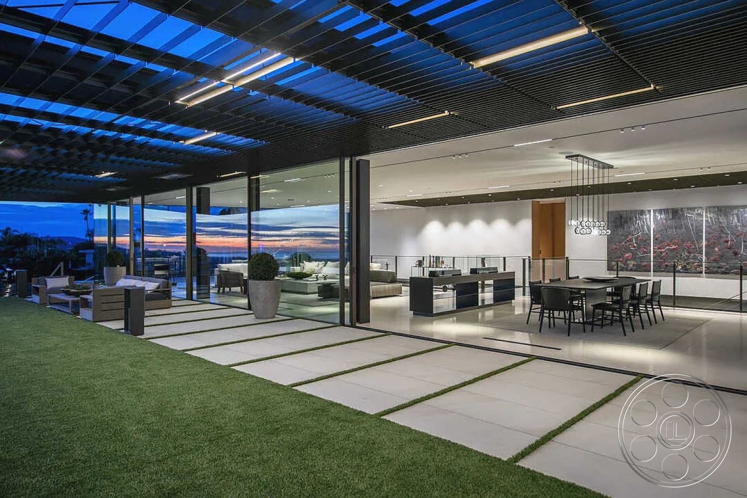 Modern 517 - interior wall art, interior open floor plan, interior wood beam ceiling, interior recessed lighting fixtures, interior minimalist design, interior high ceilings, interior sleek kitchen cabinetry, exterior concrete patio flooring, exterior glass wall panels, architectural style contemporary, exterior artificial grass landscaping, exterior linear concrete stepping stones, interior dining area with modern pendant lights, interior large glass doors for natural light, structural element floor-to-ceiling windows, setting oceanfront view, setting modern outdoor living space, interior dining table with black chairs, interior air conditioning vents, interior gray tile flooring