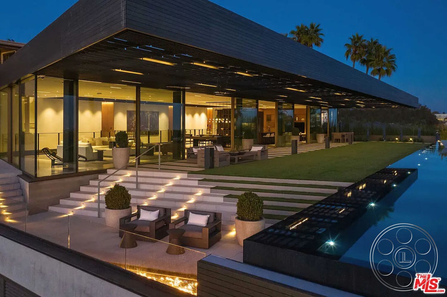 Modern 517 - minimalist design elements, concrete steps, modern architectural style, city skyline view, wooden outdoor furniture, flat roof design, exterior garden patio, exposed aggregate concrete, glass exterior walls, floor-to-ceiling glass doors, interior lounge area, open-concept interior layout, rectangular infinity pool, steel balcony railings, built-in planters, marble patio flooring, sloping lawn, stucco wall finishes, landscaped lawn setting, LED lighting accents, horizontal wood slat shades