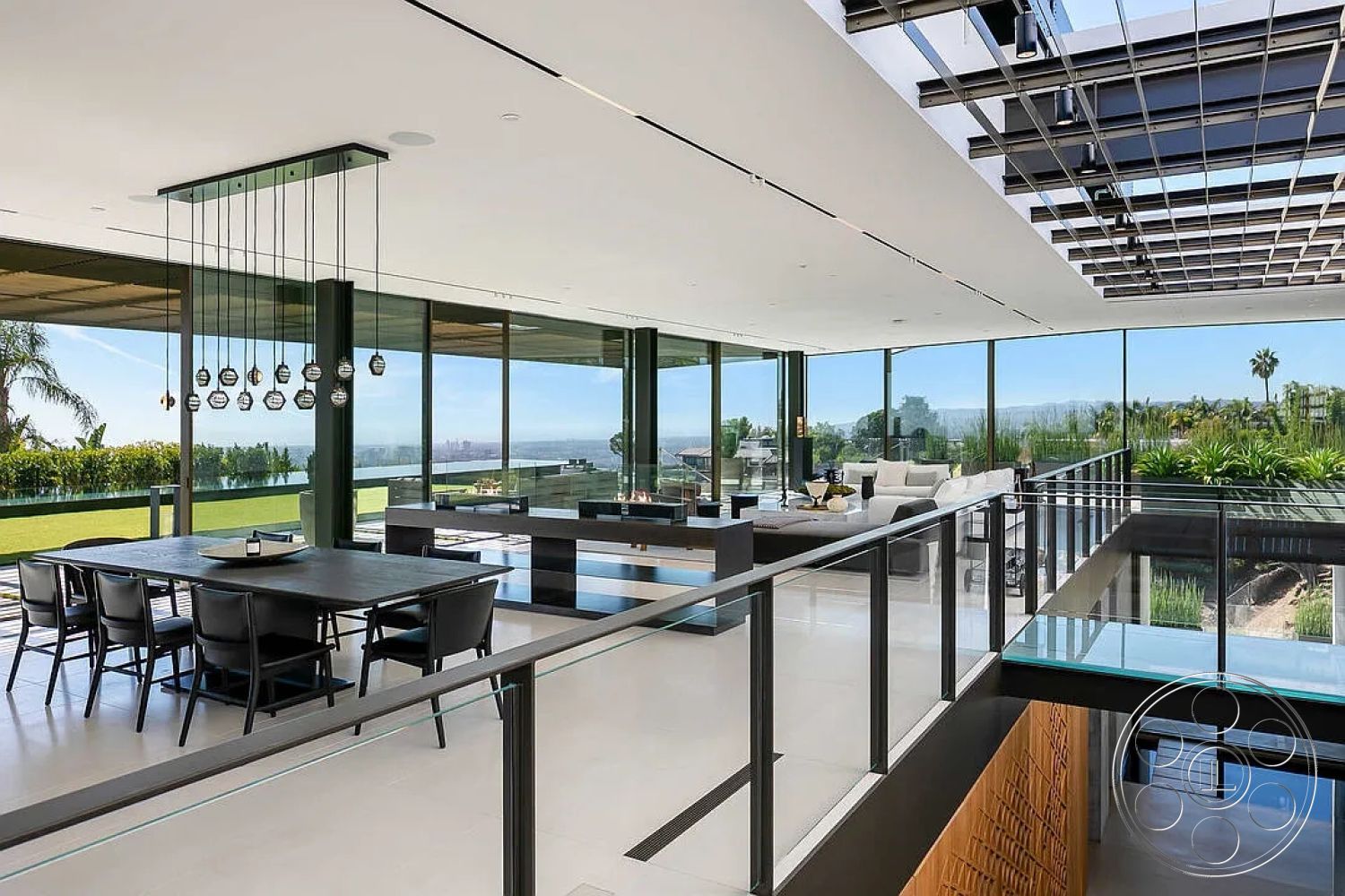 Modern 517 - neutral color palette, sliding glass doors, contemporary pendant lighting, metallic accents, urban hillside location, glass floor-to-ceiling windows, custom built-in shelving, interior modern open floor plan, spacious indoor-outdoor flow, steel cable railing, panoramic city skyline, black wood dining table, black leather dining chairs, white porcelain tile flooring, textured wooden accent wall, minimalist living room furniture, grass backyard view, green landscaping visible