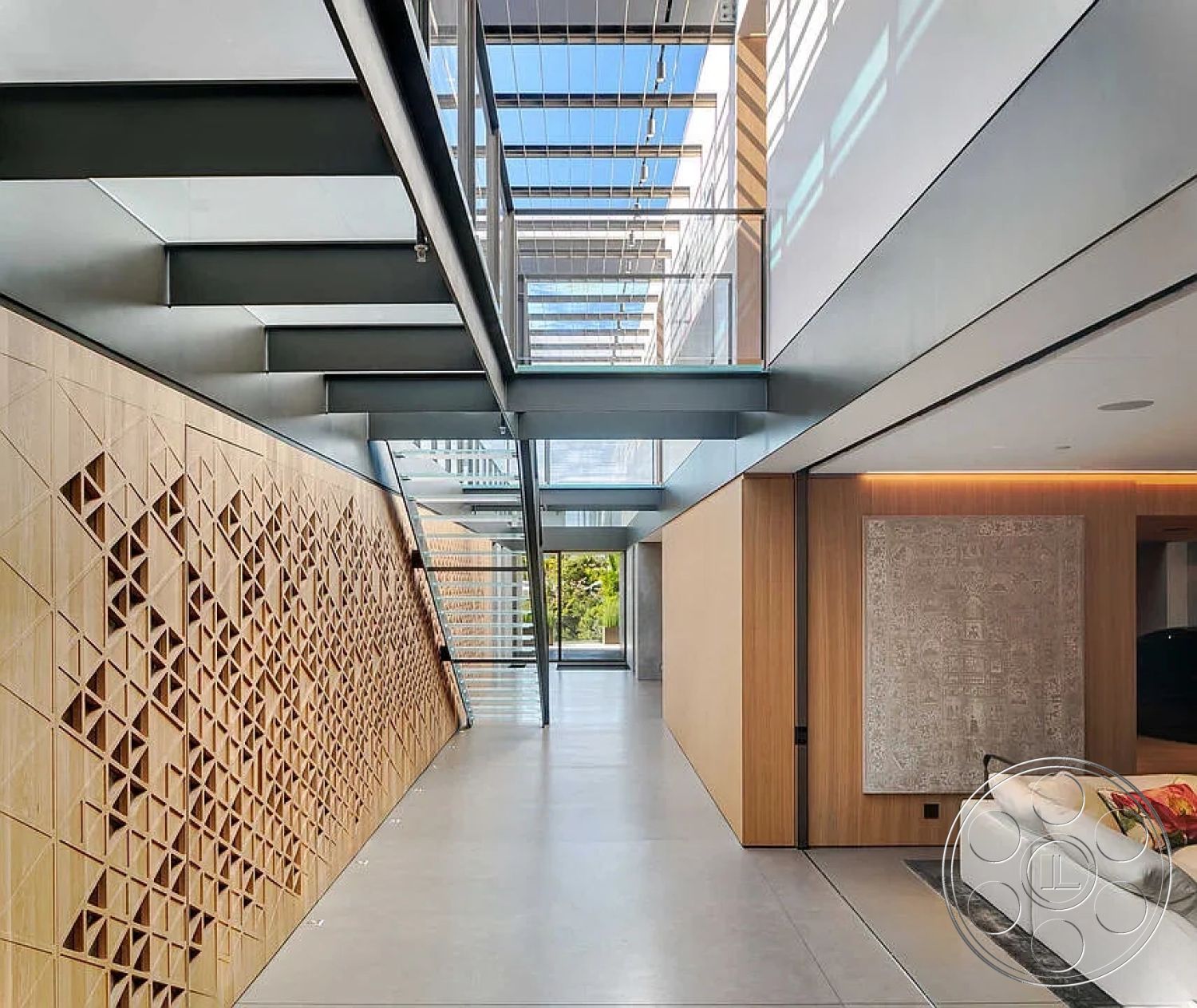 Modern 517 - polished concrete floor, open-concept living space, modern architectural style, textured wall treatment, minimalist interior design, metal stair railings, exposed wood wall panels, glass floor-to-ceiling windows, natural light enhancement, geometric wood accent wall, floating steel staircase, rectangular natural light void, sleek steel structures