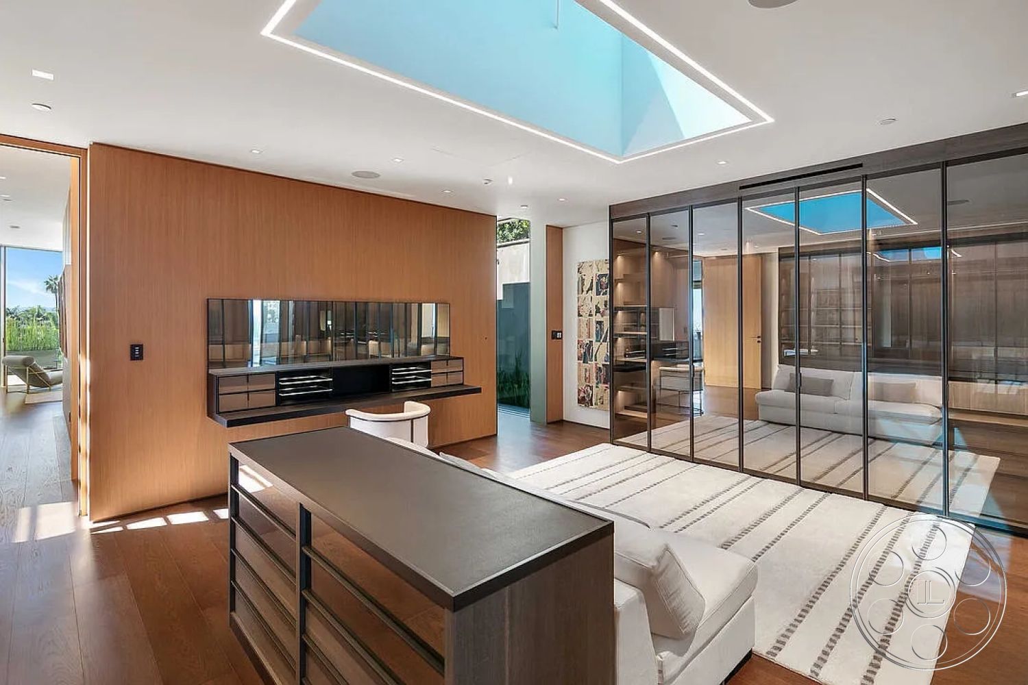 Modern 517 - minimalist decor, hardwood flooring, contemporary furniture, urban setting, bright natural lighting, city skyline view, seamless indoor-outdoor flow, luxurious living room, open concept living area, skylight ceiling, interior lounge space, modern glass partition walls, textured wood accent wall, linear ceiling lighting, laminate kitchen cabinets, mirrored vanity table