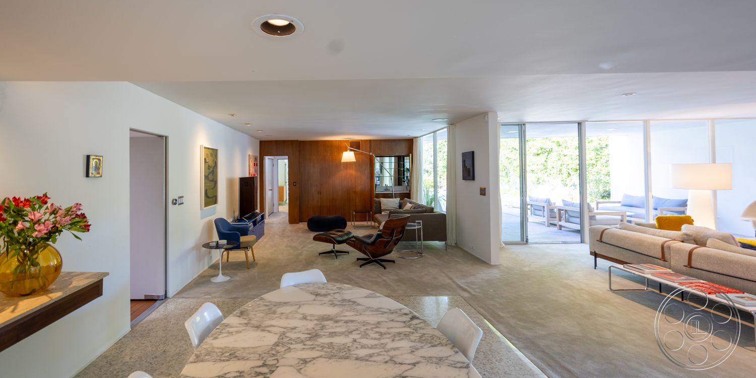 MCM 27 - interior minimalist decor, interior recessed ceiling lighting, interior open floor plan, interior built-in cabinetry, interior large glass windows, interior concrete flooring, interior marble dining table, interior decorative wall art, interior geometric coffee table, interior cozy living room, interior mid-century modern design, interior exposed wood accent wall, interior sleek kitchen island, interior hardwood door frames, interior contemporary sofa