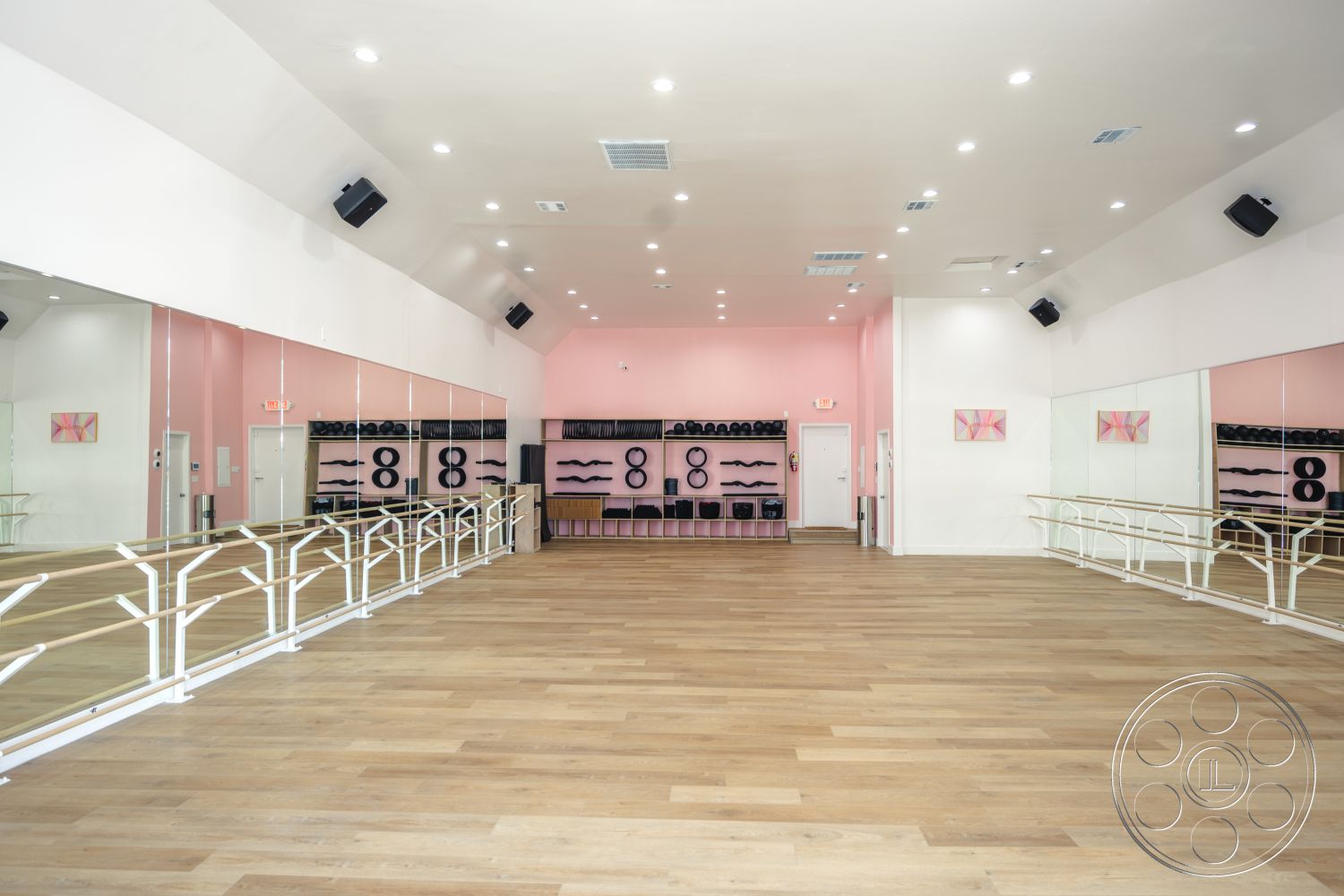 Gym 37 - high ceilings, natural light, hardwood flooring, modern design elements, decorative artwork, recessed ceiling lights, open layout design, mirror wall treatment, sound system speakers, interior ballet studio, pink painted walls, white barre railing, stretched ceiling, black storage shelves, dance space