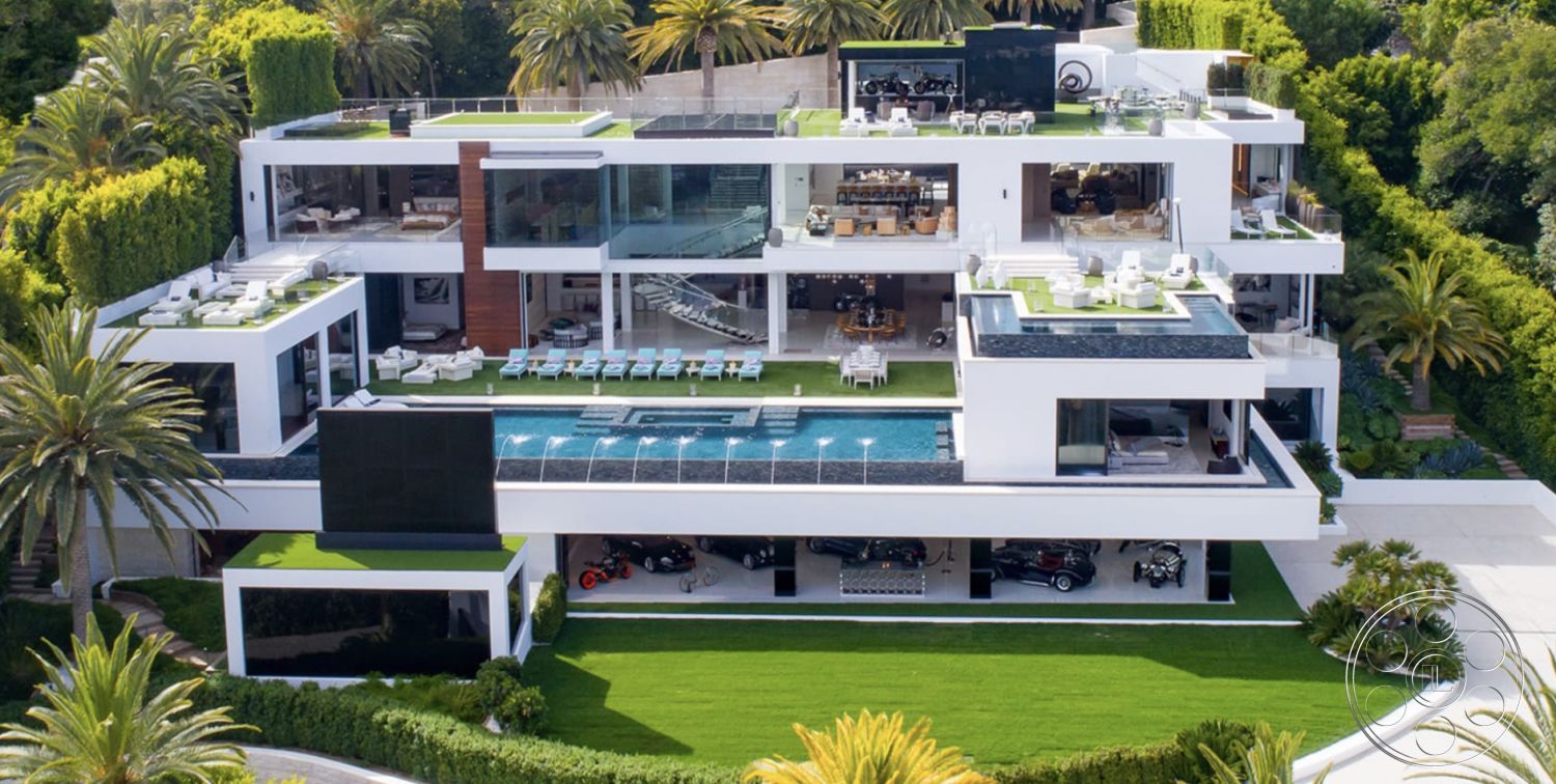 Modern 518 - sliding glass doors, modern outdoor furniture, green landscaping, floor-to-ceiling windows, multiple levels, concrete driveway, open concept living space, infinity pool, natural stone steps, stylish architecture, exposed stone wall, stone pool deck, flat roof design, urban hillside location, wood beam ceiling, curved patio design, interior lounge area, glass balcony railings, landscape lighting features, luxury outdoor lounge area, desert home setting