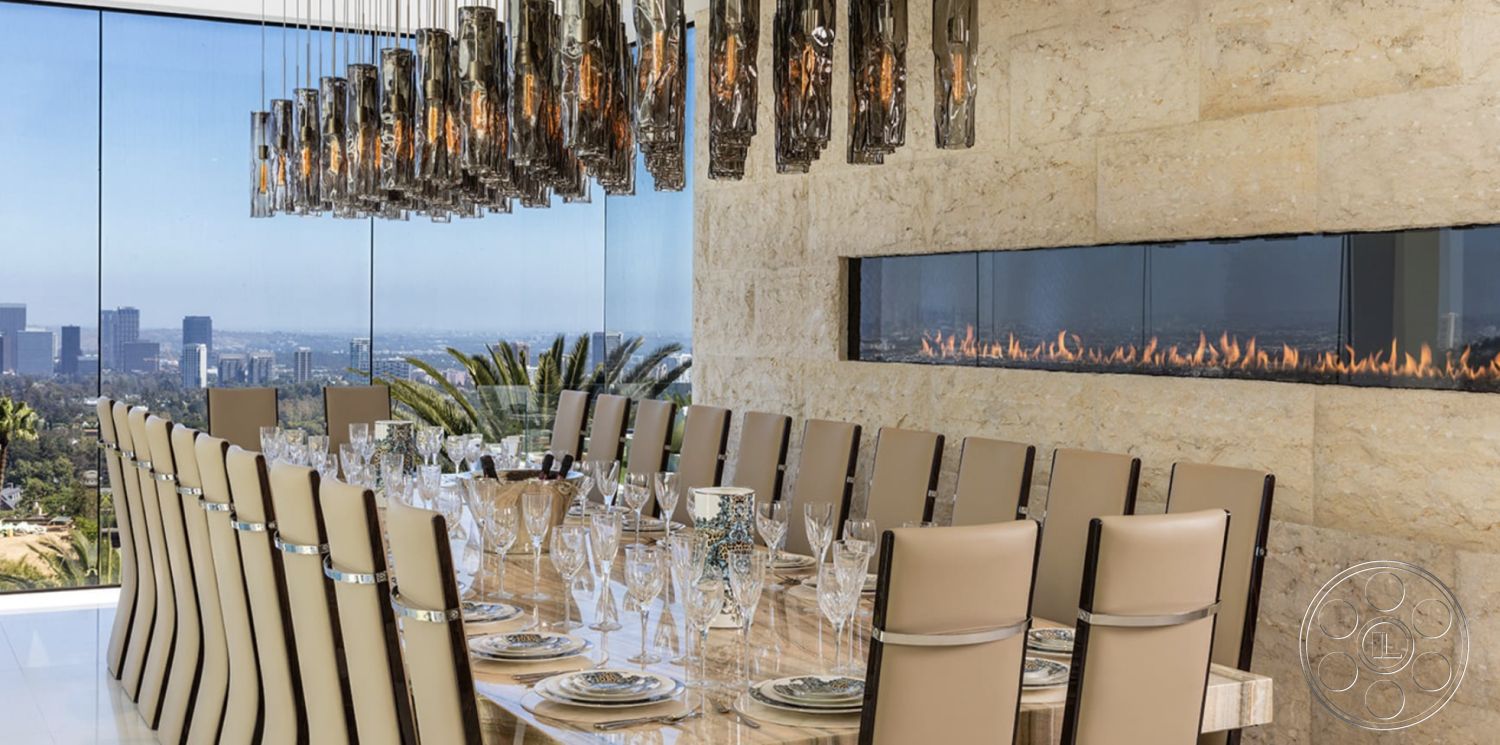 Modern 518 - neutral color palette, smooth stone flooring, rectangular dining table, open dining area, stone feature wall, contemporary architectural style, leather dining chairs, minimalist interior design, modern pendant lighting fixtures, floor-to-ceiling glass windows, panoramic city skyline view, polished marble dining table top, built-in linear fireplace, luxury dining setting, high-ceiling interior