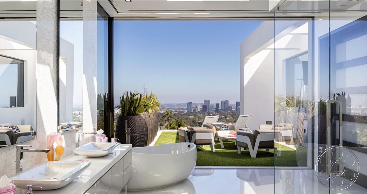 Modern 518 - minimalist decor, outdoor seating area, exposed concrete wall, floor-to-ceiling windows, textured wall paneling, landscaped terrace, city skyline view, polished stone flooring, ceramic sink, lush green landscaping, modern lounge chairs, glass shower doors, interior bathroom design, modern freestanding bathtub, white painted walls, open-concept interior, marble bathroom countertops, contemporary shower area, luxury outdoor patio area, secondary outdoor space