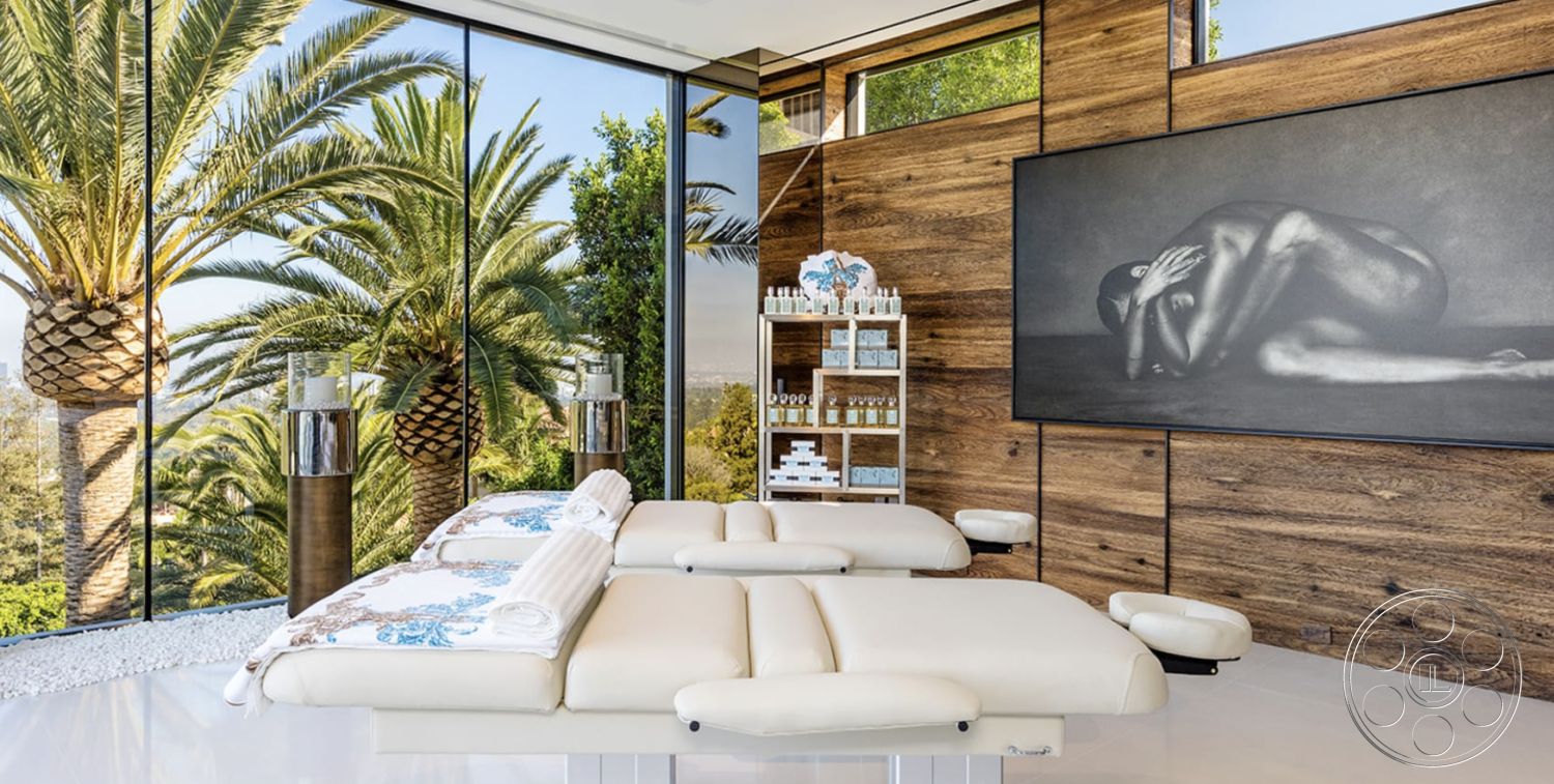 Modern 518 - serene atmosphere, polished concrete flooring, natural light from large windows, exposed wood ceiling beams, modern architectural design, palm tree landscape, glass wall panels, tropical garden view, interior spa room, wood feature wall, minimalist spa decor, soft leather massage tables, clutter-free shelving unit, bright spa environment, zen-inspired interior