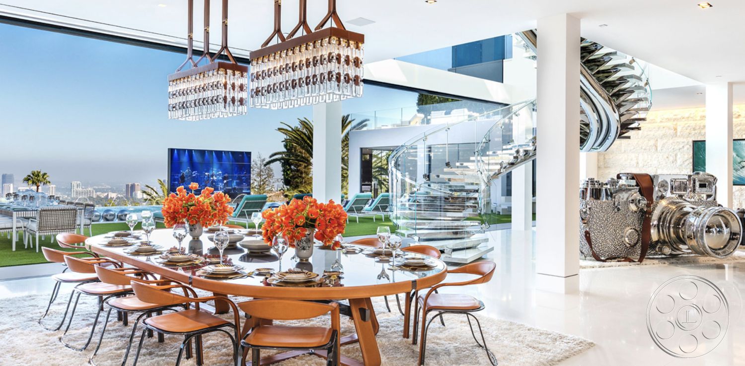 Modern 518 - floor-to-ceiling windows with ocean view, textured stone accent wall, interior dining area with glass wall, round wooden dining table with metallic accents, high-back wooden dining chairs with curved legs, luxury chandelier with crystal details, spacious open-concept layout, contemporary kitchen with stone countertops, glass spiral staircase with stainless steel railings, marble living room flooring, modern area rug under dining table, exterior patio with modern furniture, urban skyline view from interior, indoor-outdoor flow with sliding glass doors, lush greenery surrounding outdoor area, white plaster walls with minimalist decor, elegant floral table centerpiece, luxury home with contemporary design elements