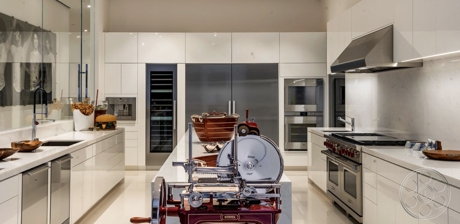 Modern 518 - stainless steel appliances, polished concrete flooring, reflective surfaces, high ceiling, undermount sink, large kitchen island, natural light-filled space, open layout kitchen, contemporary kitchen style, quartz kitchen countertops, designer pendant lighting, glass partition wall, bright and airy interior, minimalist modern design, white lacquered cabinetry, integrated fridge and freezer, hidden appliances