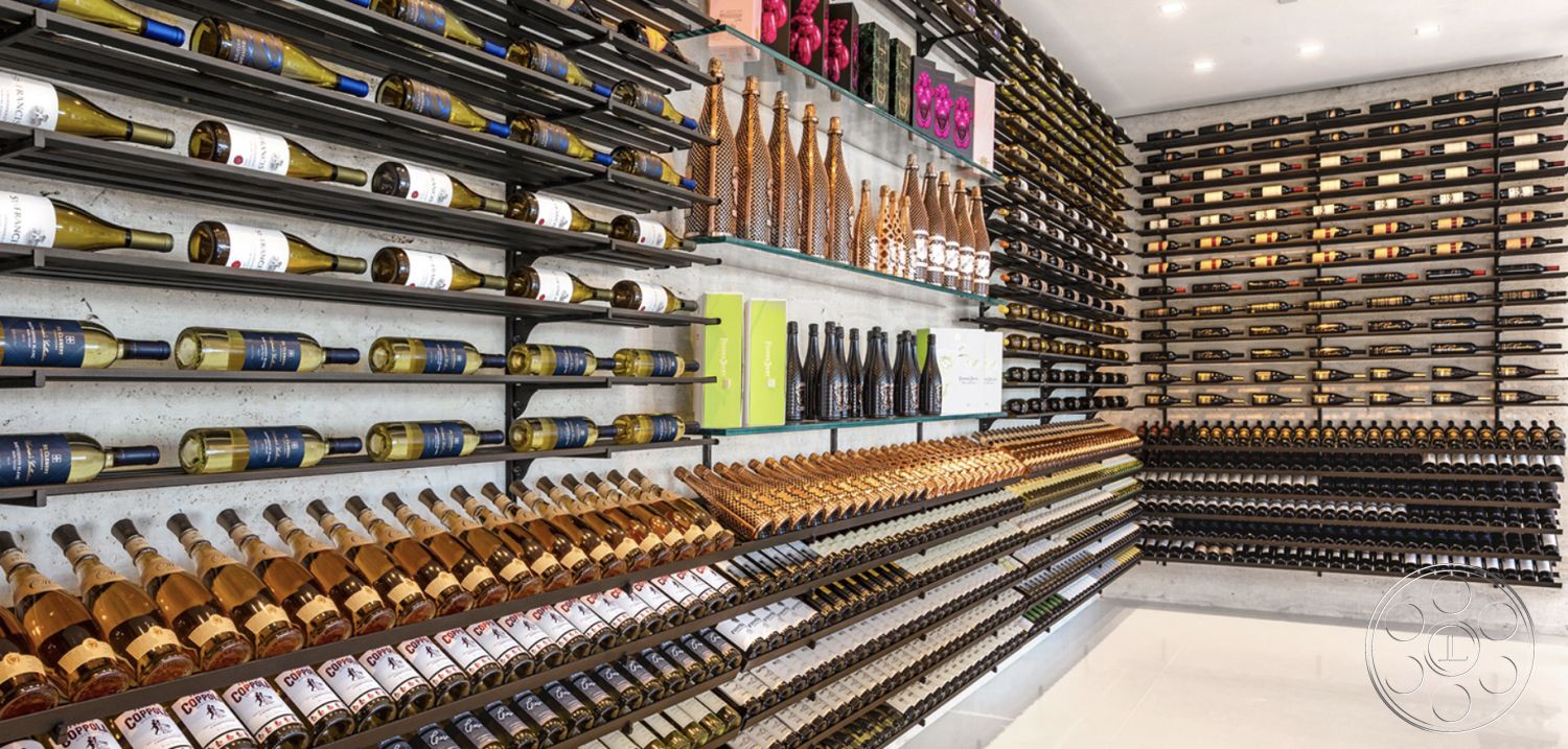 Modern 518 - polished concrete flooring, textured wall accents, contemporary architecture, sophisticated interior, efficient space utilization, minimalist interior, ambient LED lighting, industrial-style decor, concrete wall finishes, interior wine cellar, modern wine cellar, glass wine display shelves, metal wine racks, linear wine storage design, open shelving for wine bottles, custom wine storage solutions, wine tasting area, artisanal wine presentation, strategic lighting design, organized bottle display