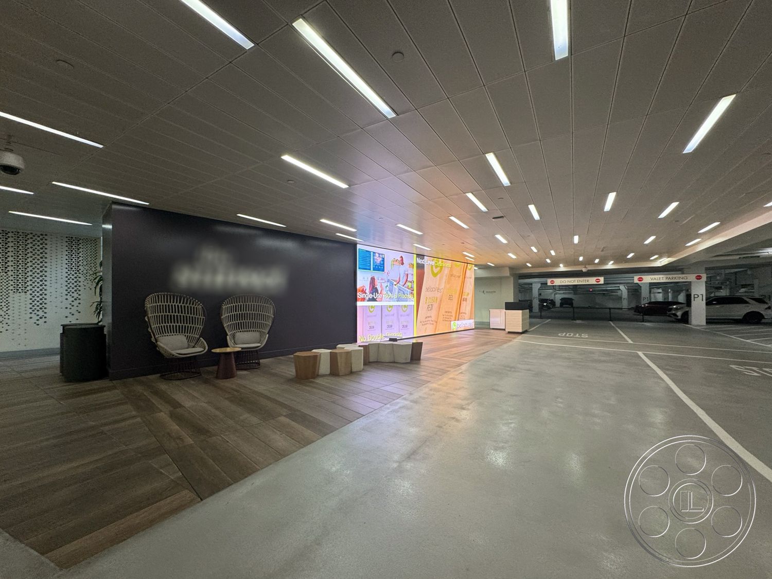 Sunset Storefront - modern lighting fixtures, textured wall panels, urban environment, contemporary design elements, decorative potted plants, multi-use space, open parking area, decorative accent wall, clean architectural lines, exposed concrete flooring, woven rattan chairs, interior parking garage, laminate wood panel flooring, retractable LED ceiling lights, backlit signage display, metal framed seating area, stylish wooden side tables, informal waiting area