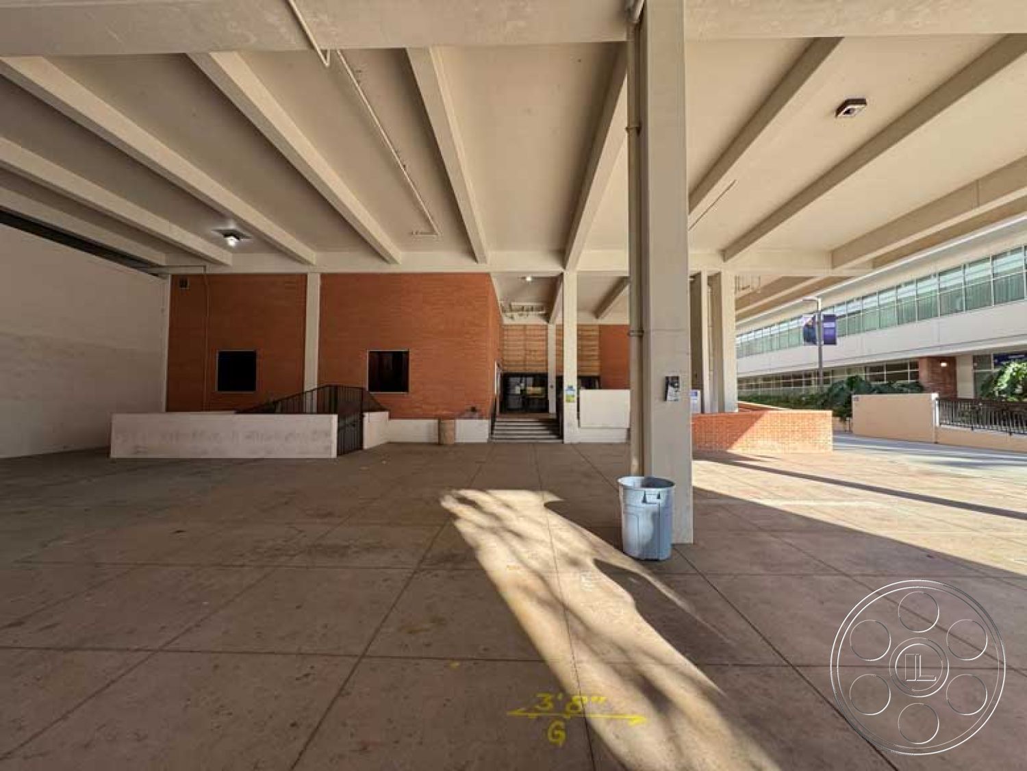 Old School - open floor plan, large glass windows, modern design elements, metal railings, urban setting, flagstone patio, functional outdoor space, brick exterior walls, natural light entry, commercial exterior, concrete ceiling beams, industrial style accents, textured concrete surfaces, public gathering space, exposed concrete parking area, finished concrete floor, architectural stairway