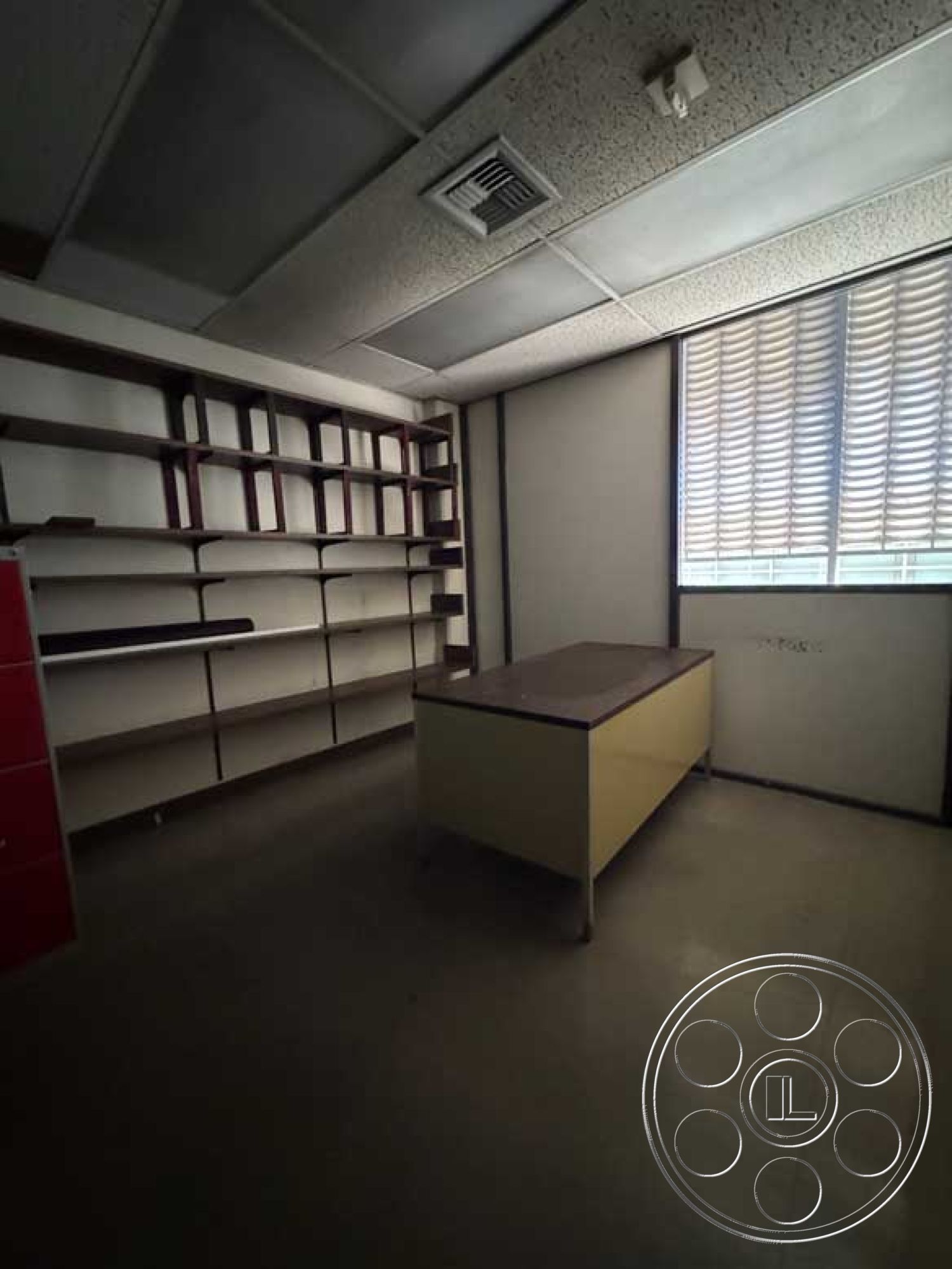 Old School - neutral color palette, minimalist design, textured plaster ceiling, interior office space, modern office layout, fluorescent ceiling lights, concrete floor tiles, large window with vertical blinds, open shelving units with wood accents, boxy table with laminate top
