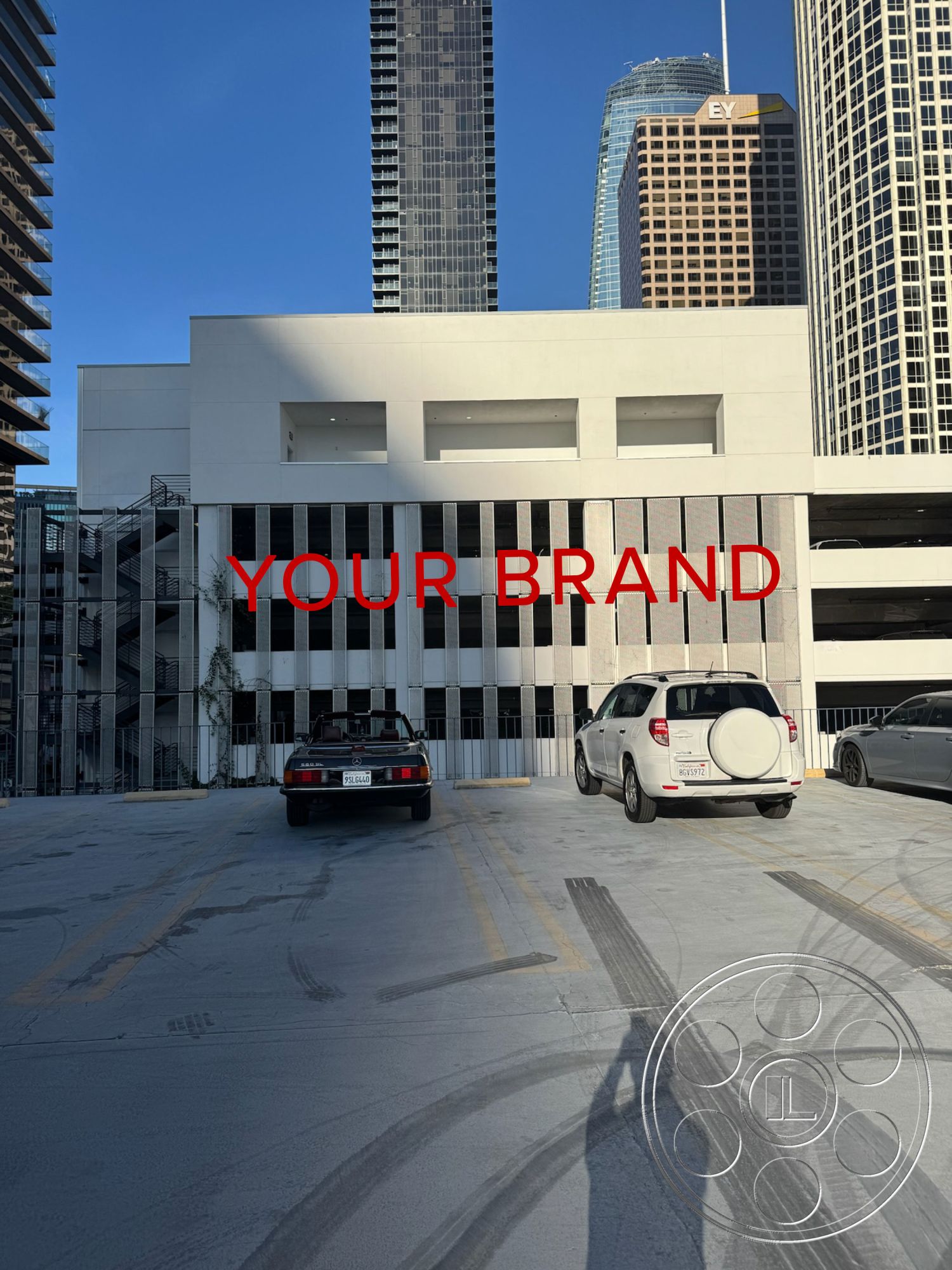 Rooftop 6 - exterior, urban setting, glass windows, modern architectural style, steel railing details, white painted concrete walls, concrete parking structure, open-air parking garage, multi-story parking facility, airport taxiway view