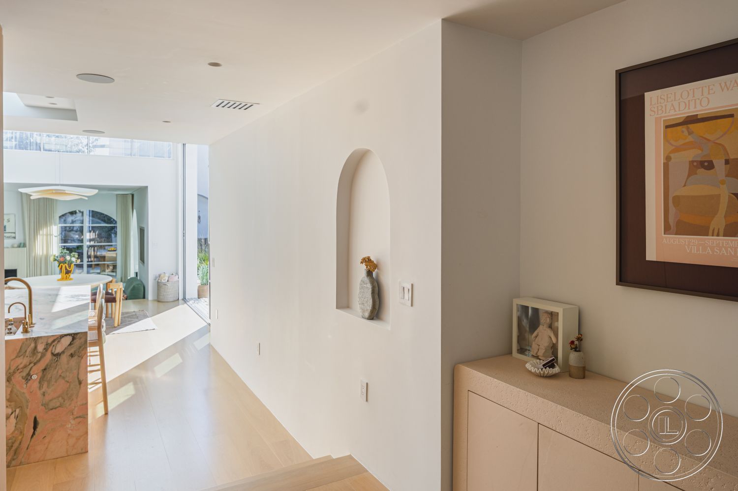 Modern 519 - interior natural light, interior hardwood flooring, interior open floor plan, interior minimalist design, interior marble kitchen island, interior smooth plaster walls, interior recessed ceiling lights, interior large windows, interior geometric shapes, interior modern artwork, interior contemporary furnishings, interior light-colored wood paneling, interior arched wall niche, interior flowing layout, interior adjacent dining area