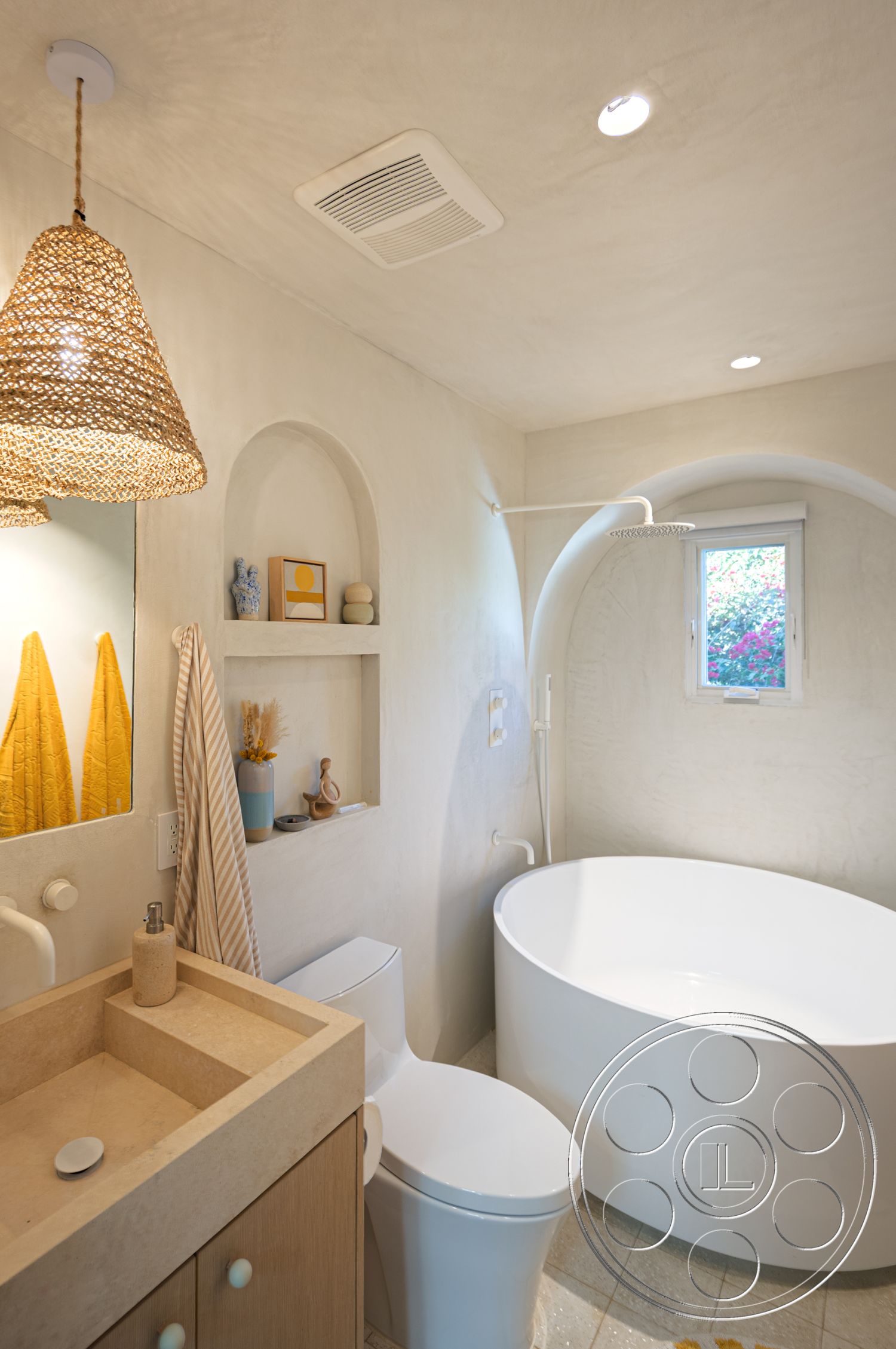 Modern 519 - spa-like atmosphere, recessed lighting, neutral color palette interior, woven pendant light fixture, exposed plaster bathroom walls, modern toilet design, contemporary bathroom layout, oval freestanding bathtub, natural stone bathroom flooring, minimalist wooden vanity with integrated sink, arched shower enclosure, soft yellow bath towels, open shelving for decor display, stylish window with natural light, cozy bath decor accents