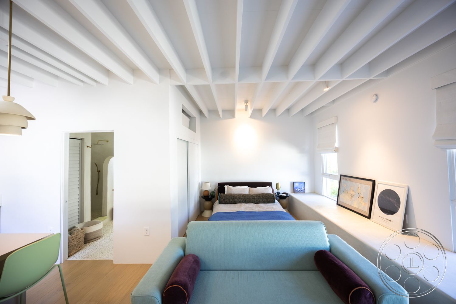 Modern 519 - neutral color palette interior, exposed wood ceiling beams interior, white painted walls interior, open floor plan interior, arched doorway interior, modern pendant lighting interior, minimalist decor interior, light hardwood flooring interior, modern artwork display interior, indoor-outdoor flow interior, textured area rug interior, large windows for natural light interior, smooth plaster walls interior, contemporary bedroom design interior, clean lines and shapes interior, glass shower enclosure bathroom, compact bathroom design interior, integrated storage solutions interior, stylish lounge area interior, multi-functional living space interior