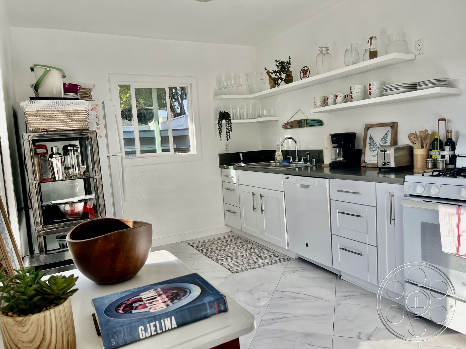 Craftsman 56 - stainless steel refrigerator, interior kitchen, black granite kitchen countertops, minimalist kitchen decor, functional kitchen workspace, contemporary kitchen style, natural light kitchen, white shaker kitchen cabinets, modern kitchen sink, open shelving kitchen design, marble kitchen flooring, glass dishware display, wooden bowl centerpiece, textured kitchen rug