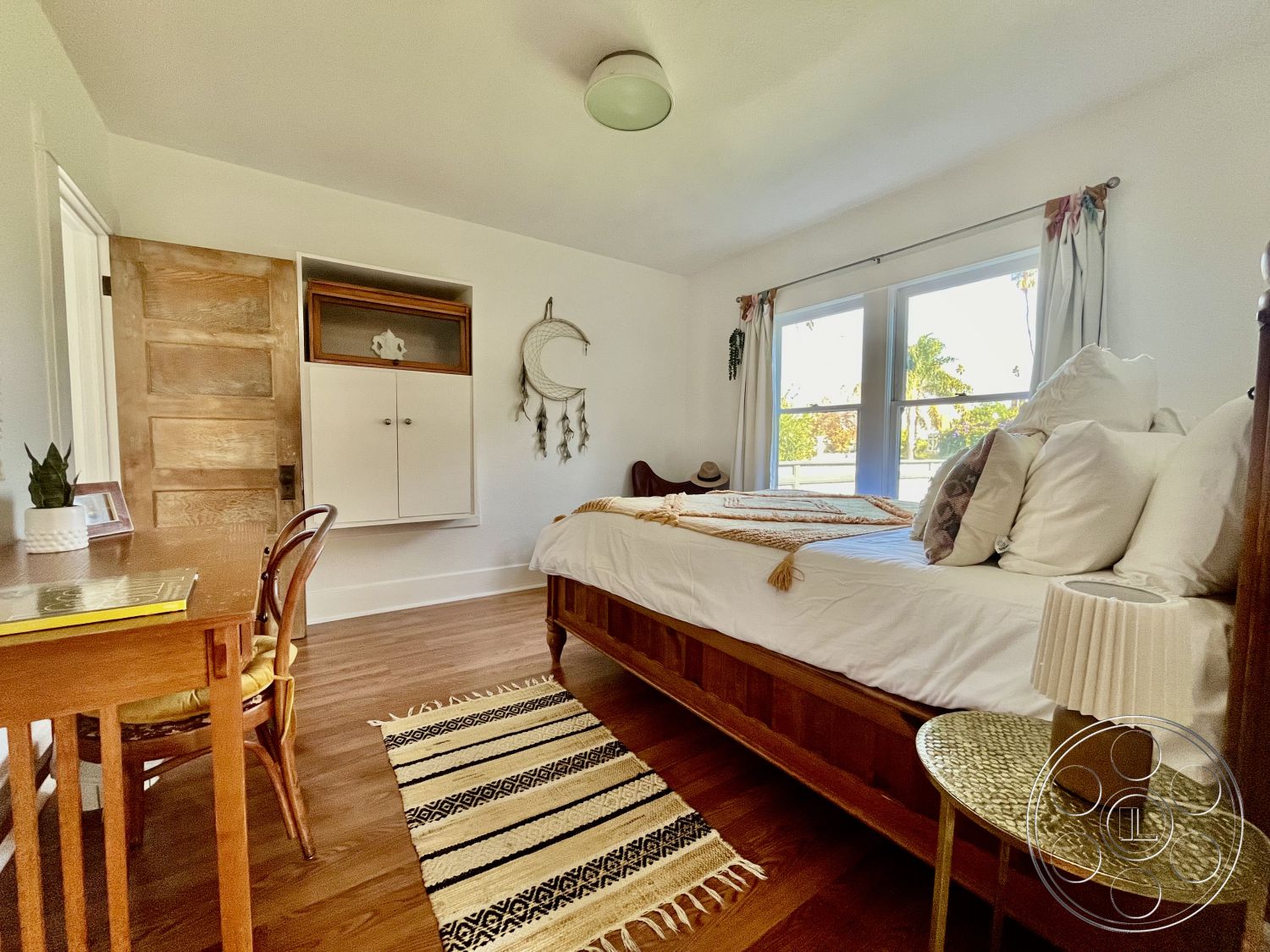 Craftsman 56 - neutral color palette, textured area rug, minimalist design elements, comfortable bedding, interior bedroom, glass window treatments, natural light interior, hardwood bedroom floors, white painted walls, tropical garden view, built-in storage cabinet, modern ceiling light fixture, decorative wall hangings, wooden desk with chairs, simple wooden furniture