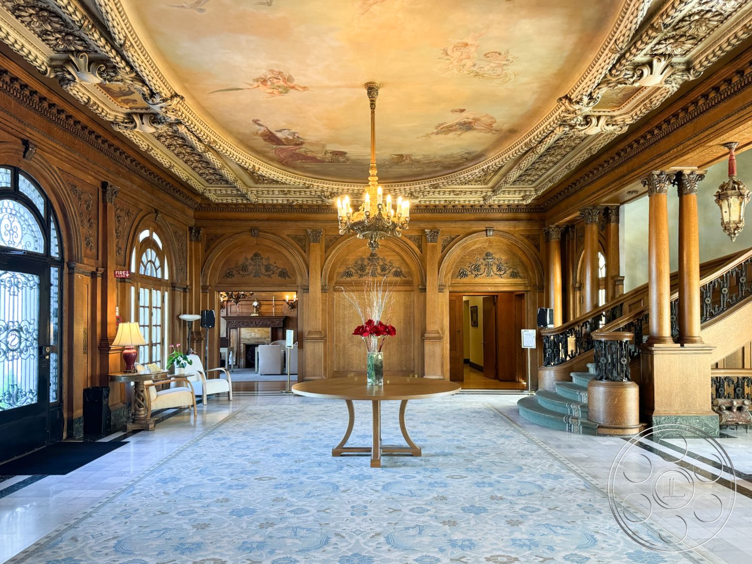 Adams Mansion - interior wood paneling, interior coffered ceiling, interior marble flooring, interior high ceilings, interior arched doorways, interior decorative ceiling with fresco, interior ornate chandelier, interior traditional staircase, interior floral area rug, interior large windows with detailed moldings, interior carved wooden details, interior elegant entryway, interior antique furnishings, interior fireplace with mantel, interior ornamental wall sconces, interior classical architectural style, interior fine art displays