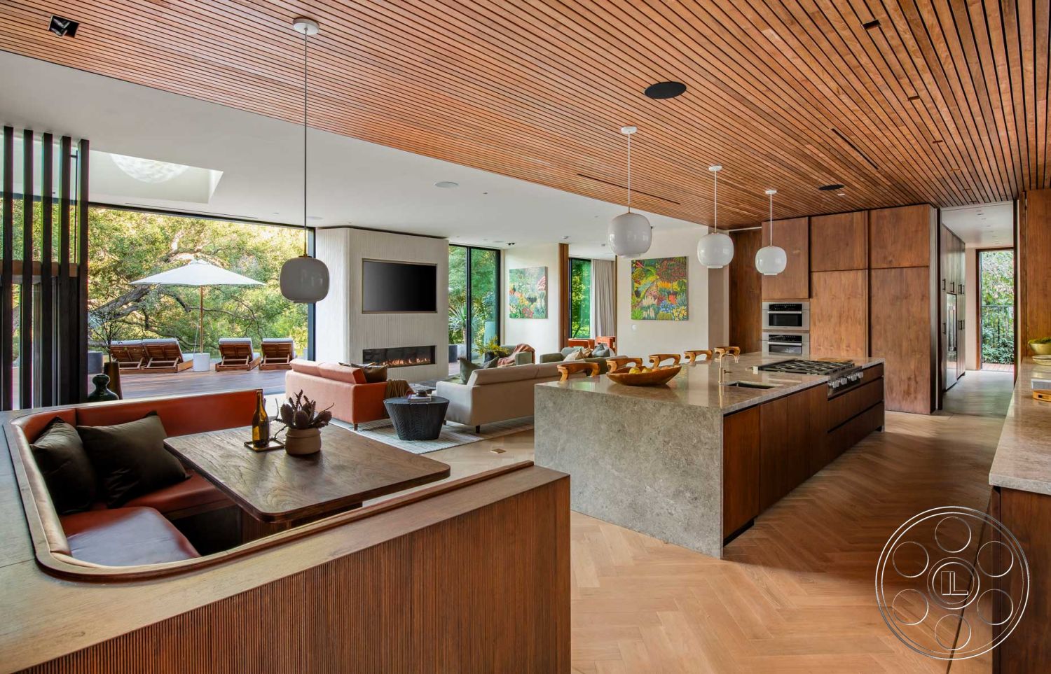 Modern 520 - neutral color palette, minimalist aesthetic, artistic wall decor, modern pendant lighting, custom cabinetry, interior space, sustainable materials, lush greenery view, wooden accent wall, open concept living area, outdoor patio access, contemporary style kitchen, glass floor-to-ceiling windows, natural wood ceiling panels, herringbone hardwood flooring, textured white plaster walls, seating area with sectional sofa, polished concrete kitchen island, kitchen with high-end appliances, integrated living and dining space