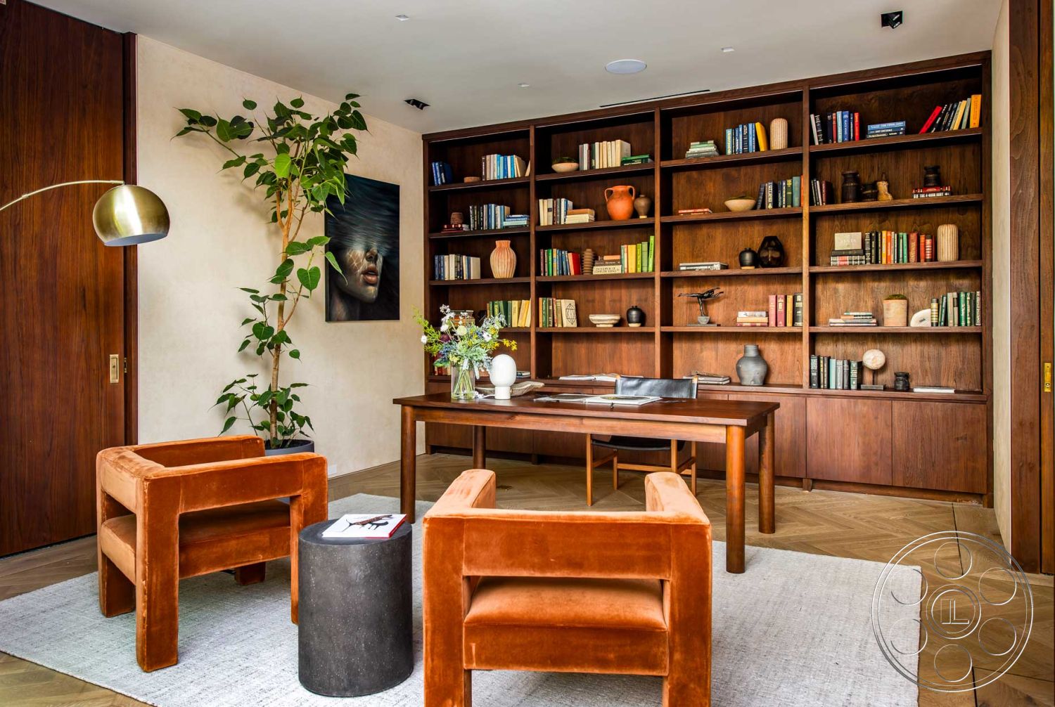 Modern 520 - modern art wall decor, functional workspace, floor-to-ceiling windows, reading nook, velvet accent chairs, plaster wall treatment, natural light ambiance, built-in wooden bookshelves, herringbone hardwood flooring, green indoor plant decor, walnut wood paneling, contemporary desk design, glass decorative vase, medium-sized area rug