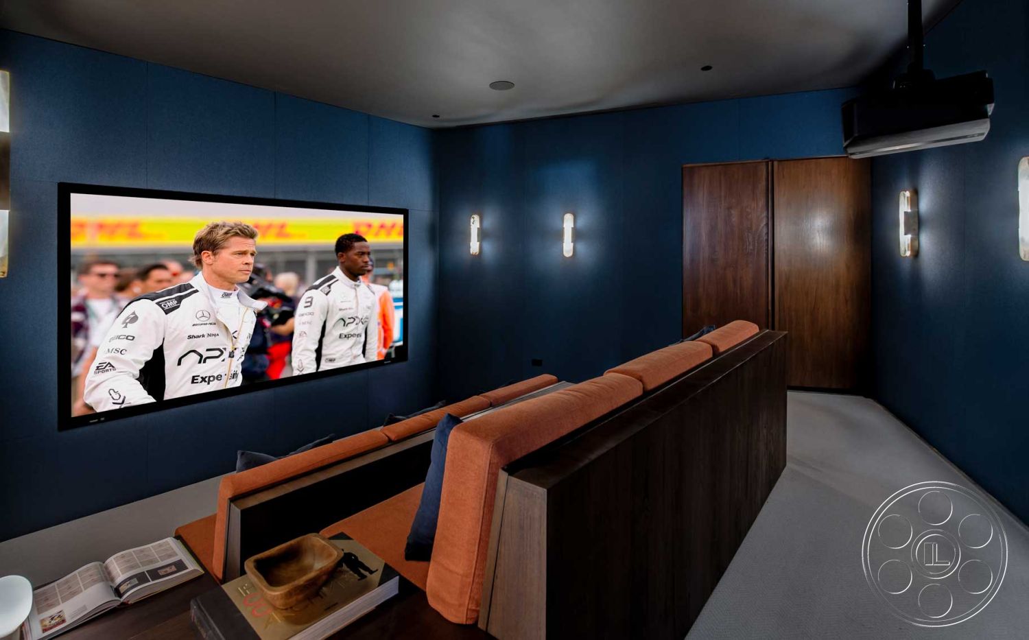 Modern 520 - neutral color palette, minimalist design, dark wood paneling, decorative wall sconces, smooth concrete floor, recessed ceiling lighting, lounge seating area, acoustic wall treatment, interior theater room, soft fabric upholstery couch, television wall-mounted display, hidden storage panels, modern entertainment space, intimate movie viewing environment