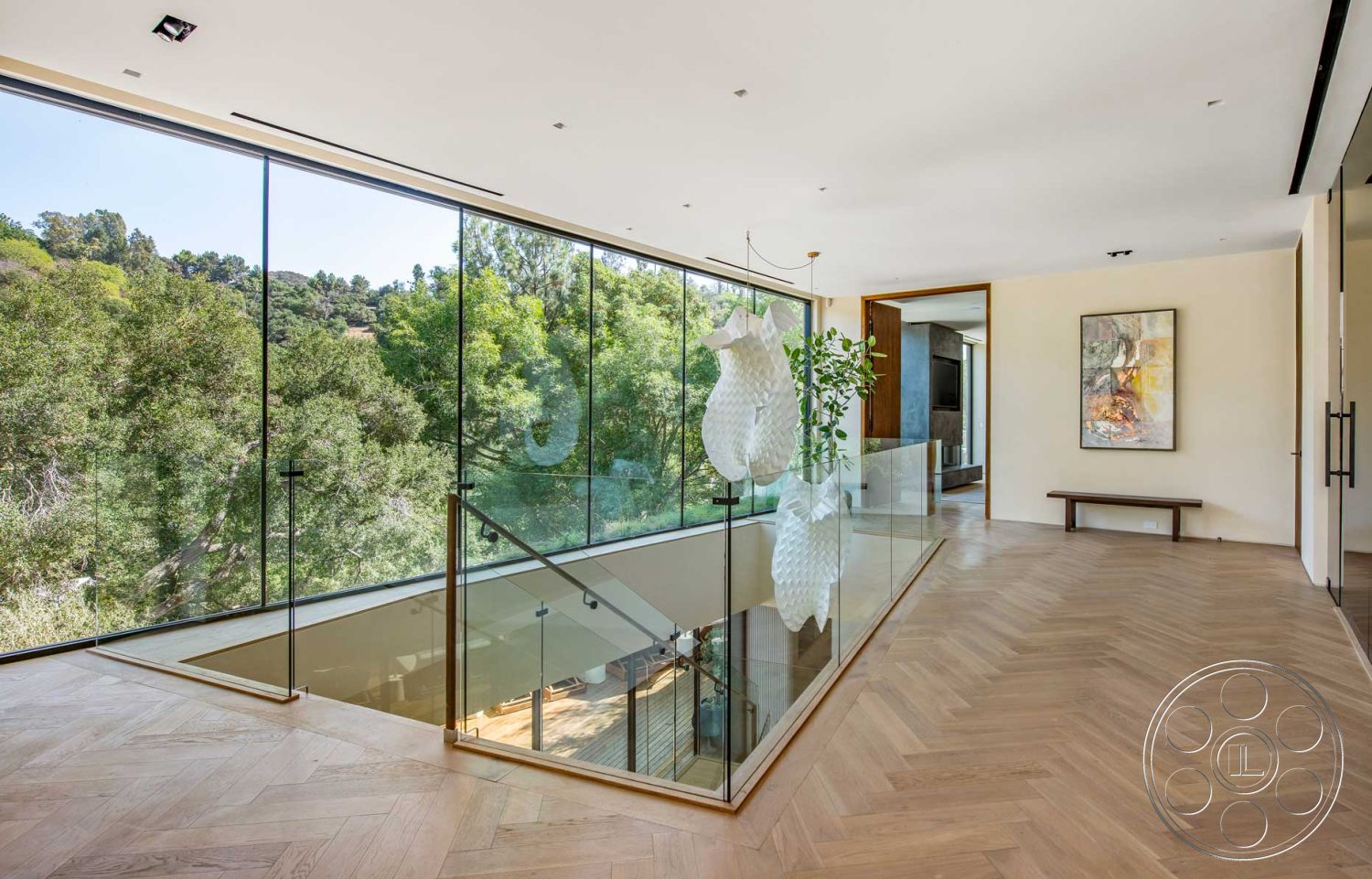 Modern 520 - natural light, neutral wall colors, wooden bench, minimalist design elements, modern pendant lighting, glass railing, artwork display, open-concept living space, seamless indoor-outdoor connection, large floor-to-ceiling windows, spacious hallway, contemporary architectural style, indoor plant accents, herringbone hardwood flooring, surrounding greenery view