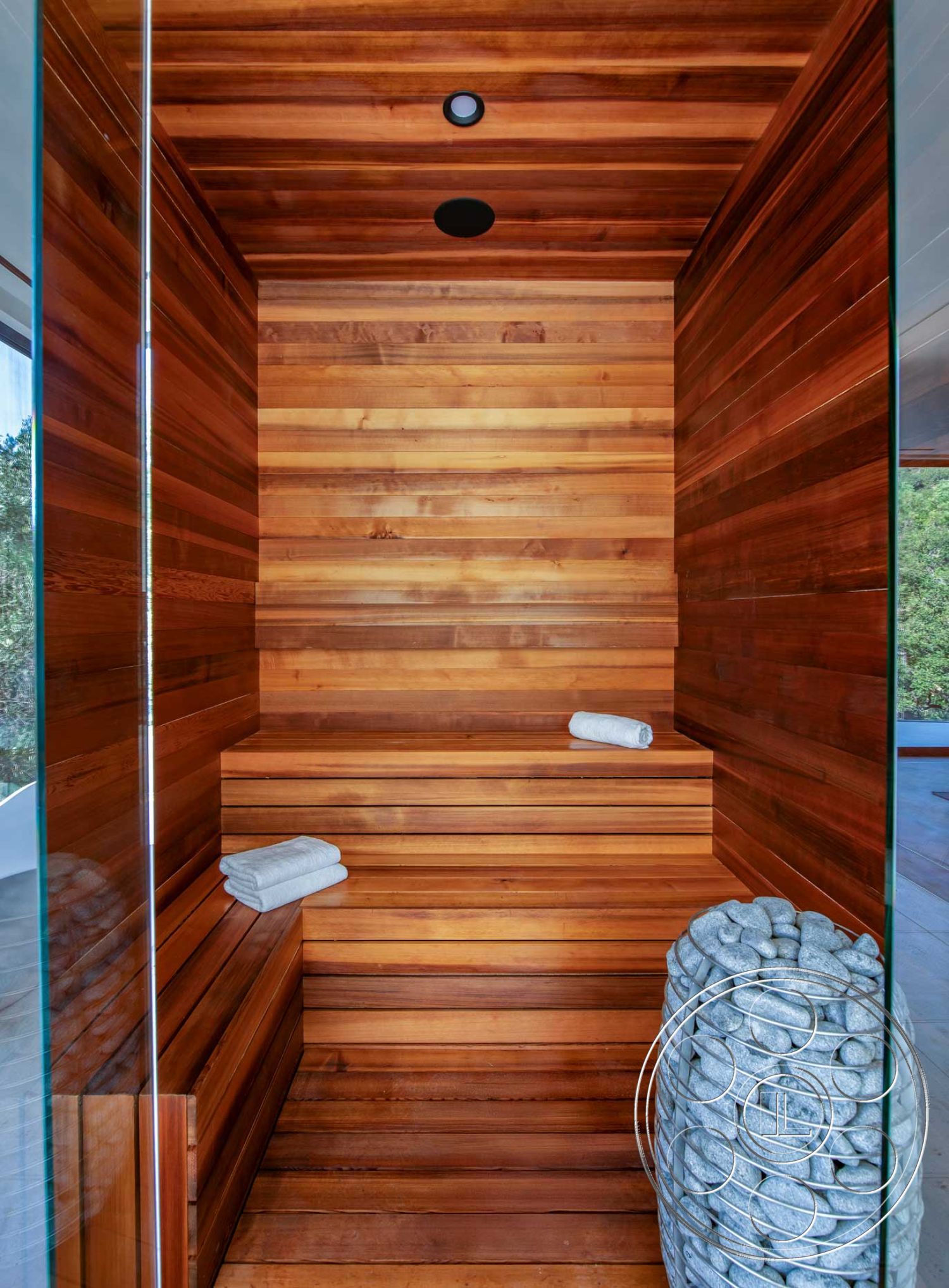 Modern 520 - glass shower enclosure, spa-like atmosphere, minimalist design elements, recessed ceiling lighting, open floor plan layout, natural wood textures, interior sauna with cedar wood paneling, horizontal cedar wood bench seating, smooth river rock accent feature, steam room style, calming interior environment
