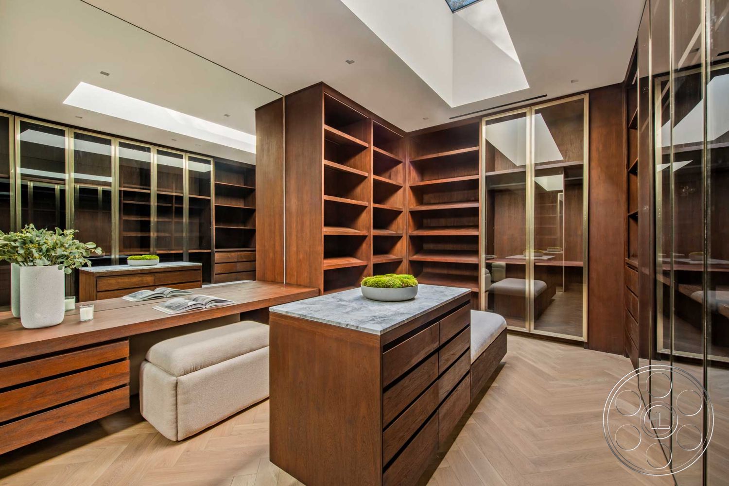 Modern 520 - interior wood paneling, interior recessed lighting, interior marble countertop, interior herringbone hardwood flooring, interior sleek cabinetry, interior glass shelving, interior skylight opening, interior built-in wooden bookcases, interior plush seating, interior brass hardware accents, interior polished stone tabletop