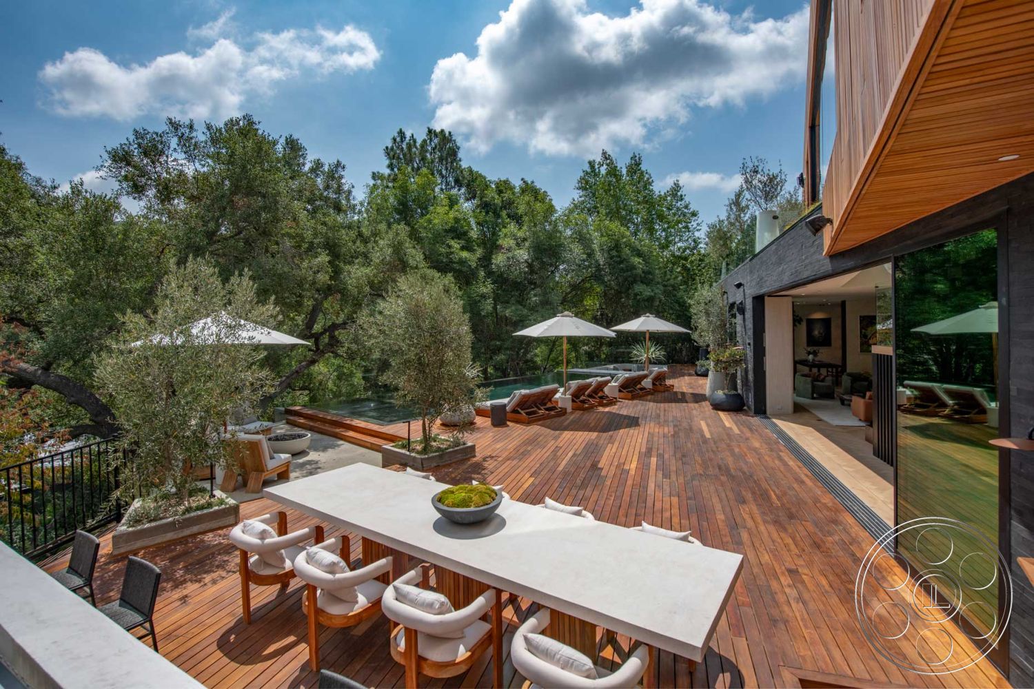 Modern 520 - rectangular swimming pool, floor-to-ceiling windows, wooden lounge chairs, concrete retaining wall, contemporary architectural style, natural light-filled space, lush greenery setting, exterior wooden deck, urban forest view, aluminum outdoor chairs, modern landscaping elements, framed glass sliding doors, stone planter pots, teakwood outdoor dining table, canvas patio umbrellas, open-concept floor plan