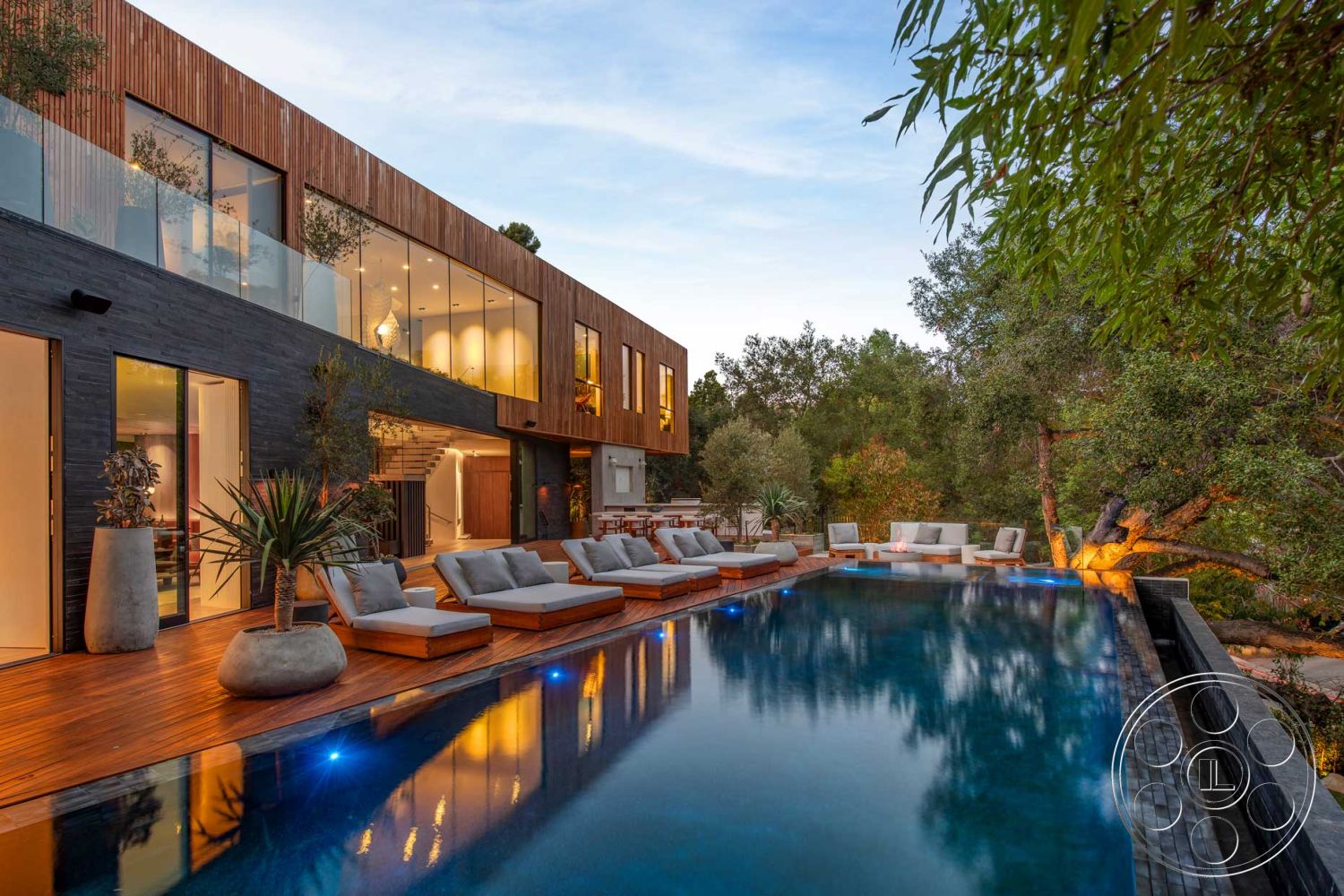 Modern 520 - interior neutral color palette, exterior landscaped garden, interior cozy seating area, interior ambient lighting, exterior natural stone accents, exterior wooden deck, interior open-concept living space, exterior floor-to-ceiling windows, exterior recessed lighting, exterior glass railing, exterior infinity pool, exterior hillside location, interior modern furniture, exterior stone pool border, exterior cut stone wall, exterior tranquil outdoor setting, exterior sustainable materials