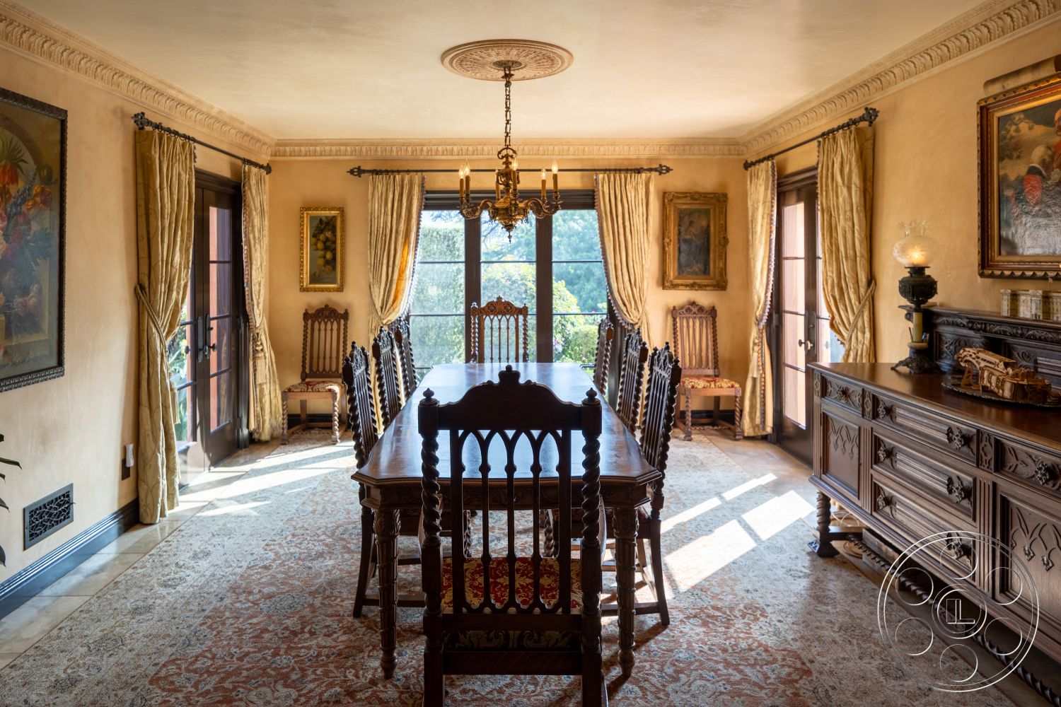 Mansion 145 - decorative crown molding, arched doorways, textured plaster walls, elegant floral arrangements, handwoven area rug, interior dining room, natural light flooding in, carved wooden dining chairs, ornate wood dining table, tufted velvet dining chairs, large glass-paneled windows, luxurious golden drapery, bronze chandelier, historic paintings on walls, traditional sideboard cabinet, frosted glass window panels