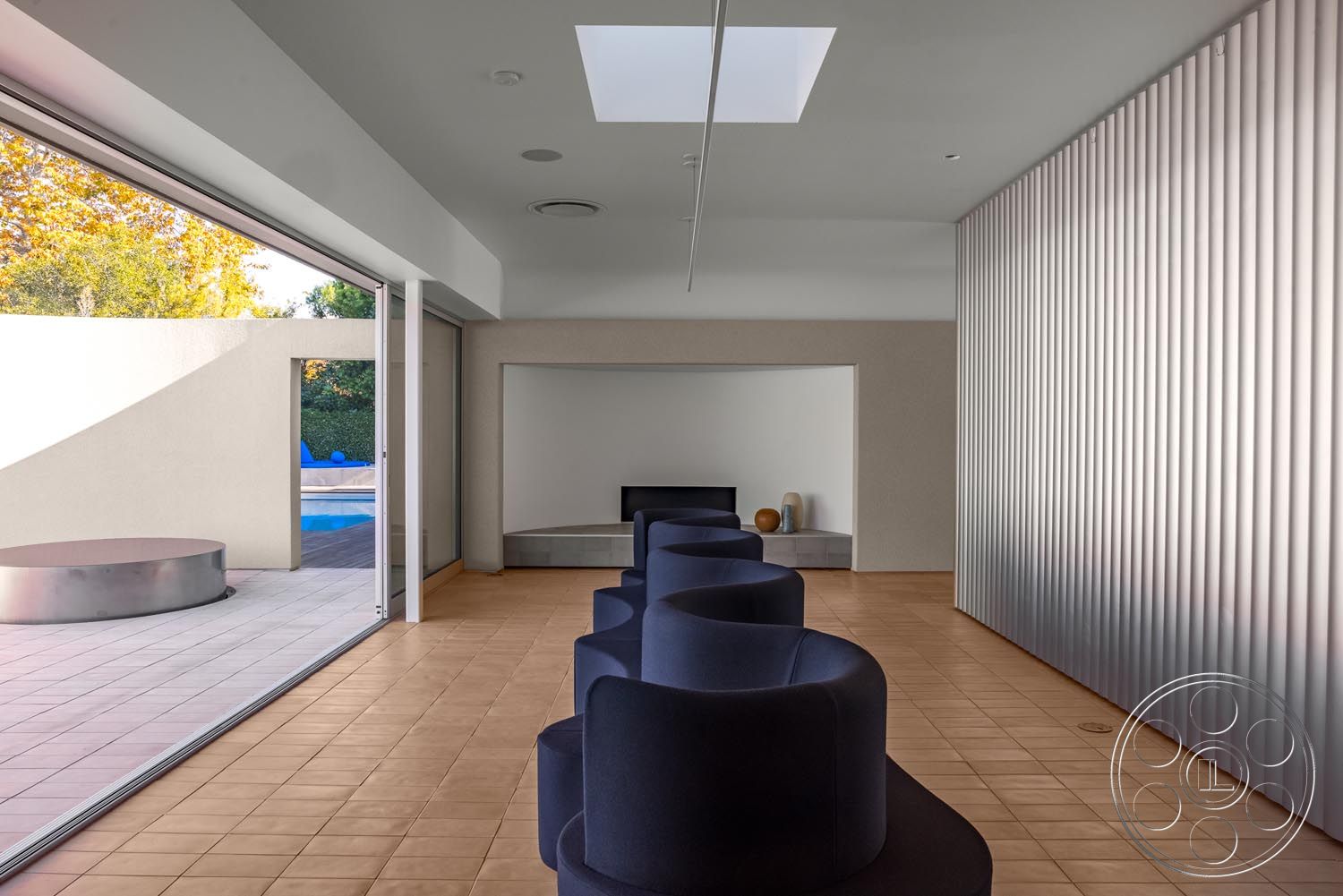 Modern 521 - interior neutral color palette, exterior landscaped garden, interior open floor plan, interior minimalist design, exterior rectangular pool, interior floor-to-ceiling glass doors, interior open living space, interior concrete wall, interior terracotta tile flooring, interior rounded furniture shapes, interior natural light emphasis, interior contemporary furnishings, exterior swimming pool area, interior artistic decor elements, interior flush skylight, interior linear wall paneling, exterior vertical wooden slats, exterior sunlit patio