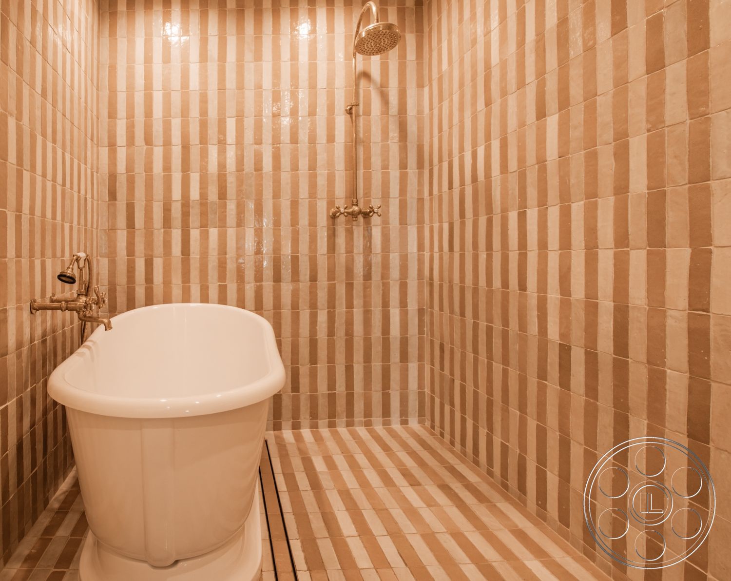 Modern Farmhouse 19 - neutral color palette, contemporary bathroom aesthetic, open shower design, natural light ambiance, minimalist bathroom layout, freestanding soaking bathtub, textured tile shower walls, striped ceramic tile flooring, modern brass fixtures