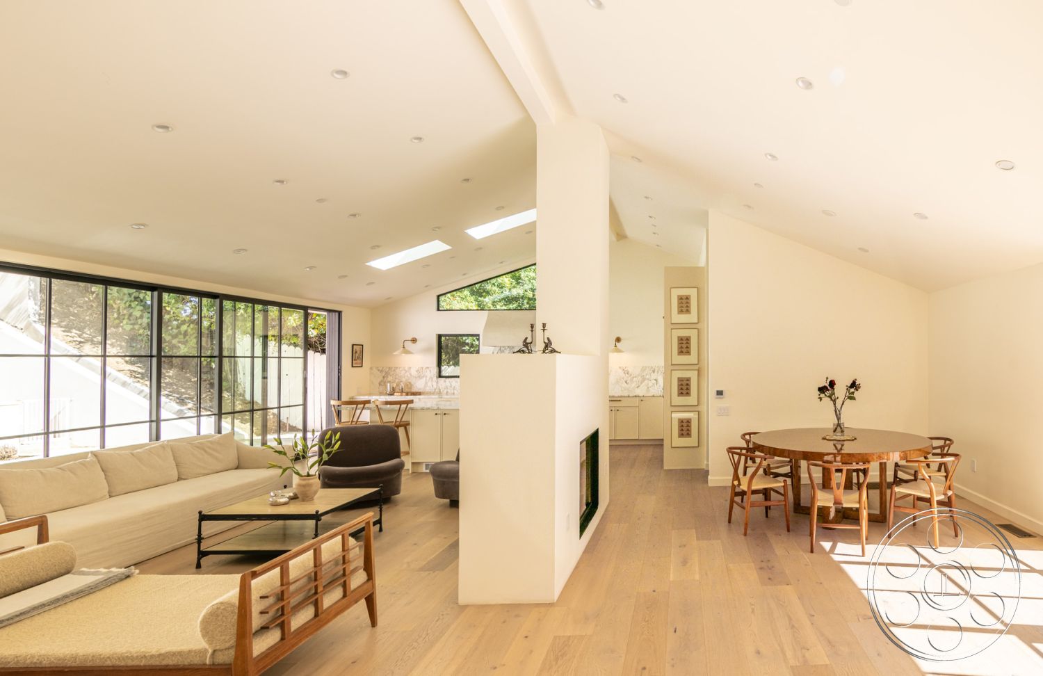 Modern Farmhouse 19 - neutral color palette, natural lighting, floor-to-ceiling windows, rectangular dining table, open-concept layout, contemporary dining area, hardwood living room floors, built-in kitchen cabinets, white painted walls, minimalist ceiling design, modern kitchen with marble countertops, exposed beam structure